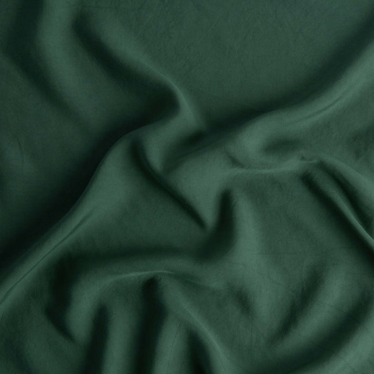 Jade: A close up of Tencel™ fabric in jade, a rich, verdant green with subtle blue undertones. 