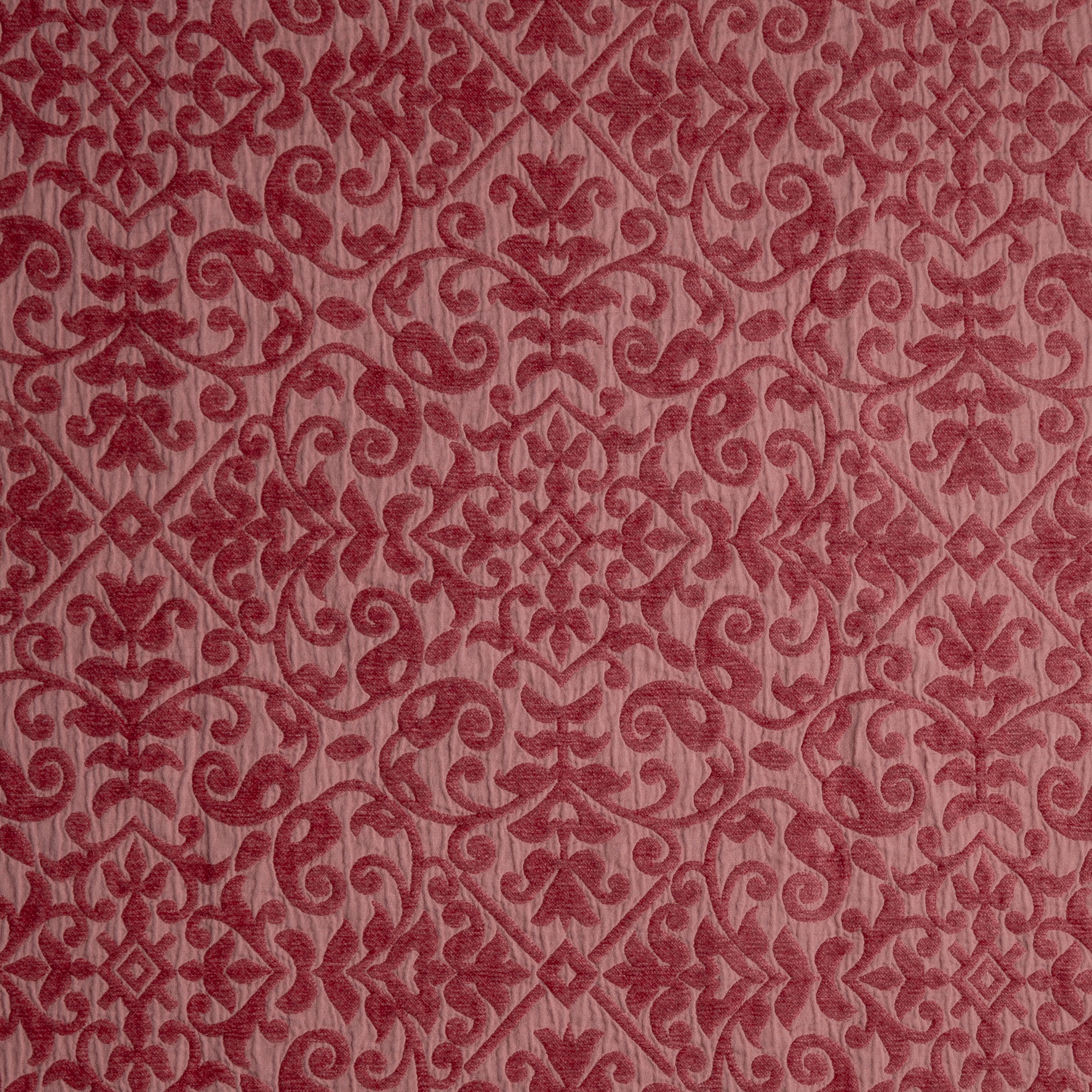 Poppy: A close up of cotton chenille fabric in poppy, a warm coral pink.