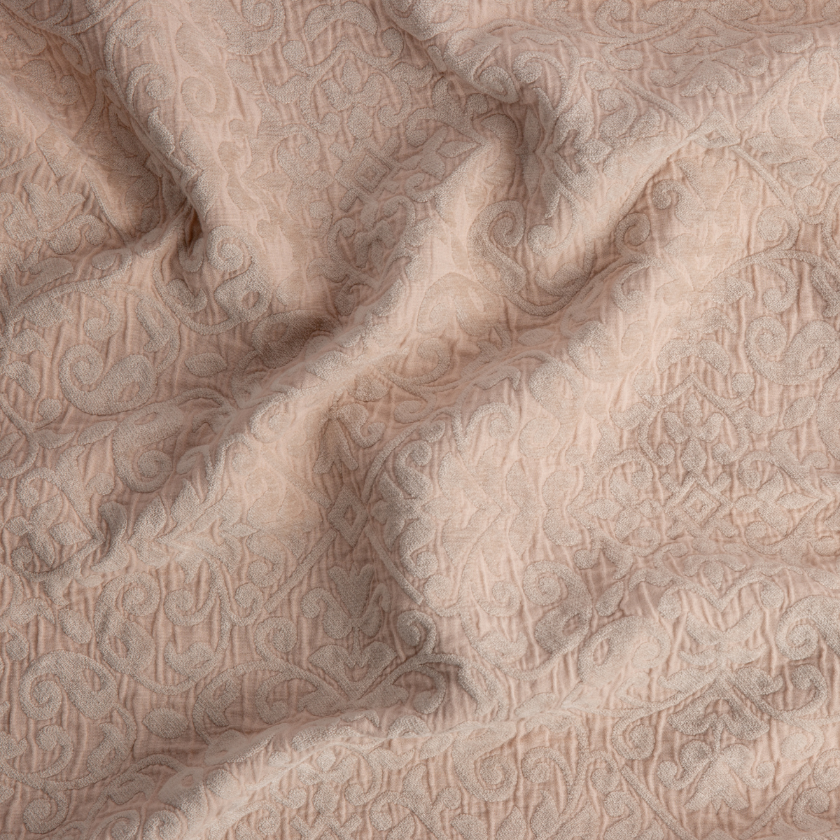 Pearl: A close up of Vienna cotton chenille jacquard in pearl, a nude-like, soft rose pink tone. 