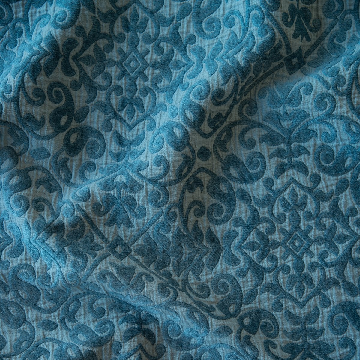 Cenote: A close up of Vienna cotton chenille jacquard in cenote, a vibrant, ocean-inspired blue-green. 