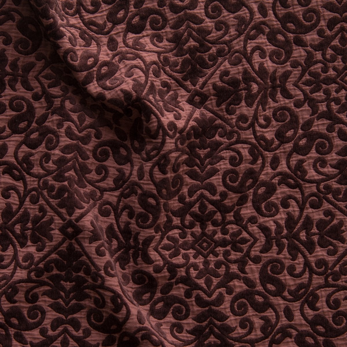 Mahogany: A close up of Vienna cotton chenille jacquard in mahogany, a deep, earthen, reddish brown. 