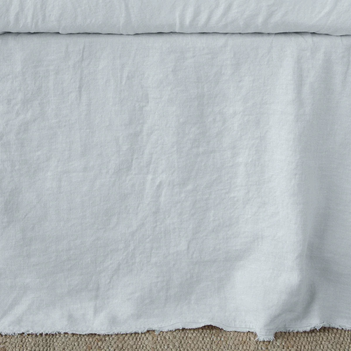 Cloud: Close up of the Austin bed skirt in cloud, highlighting its tailored, ungathered style.
