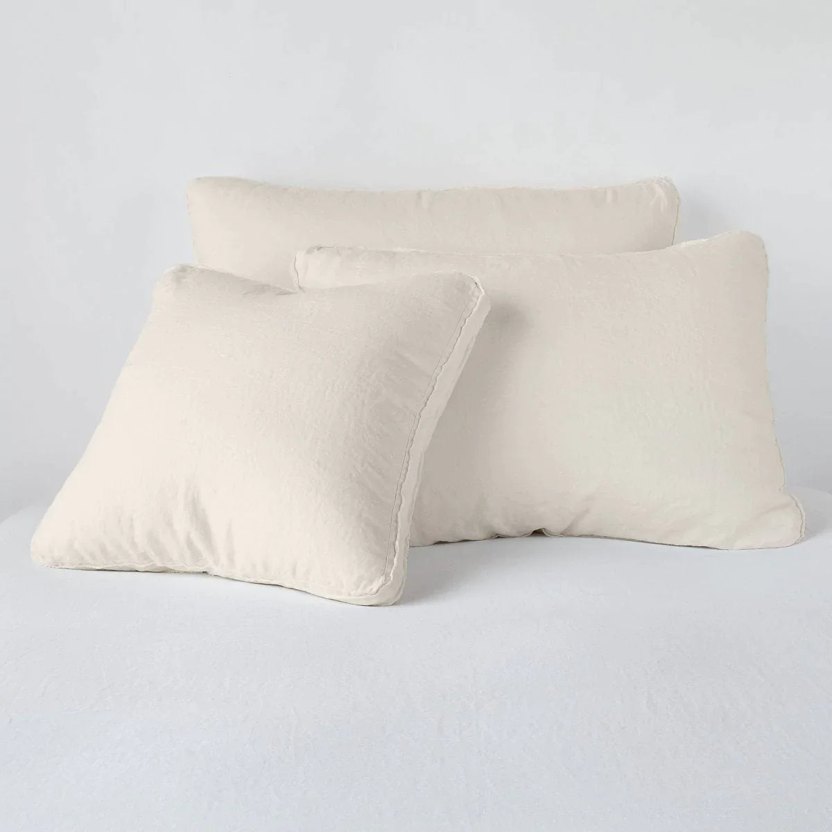 Parchment: Midweight linen shams in parchment colorway shown leaning upright on white background.