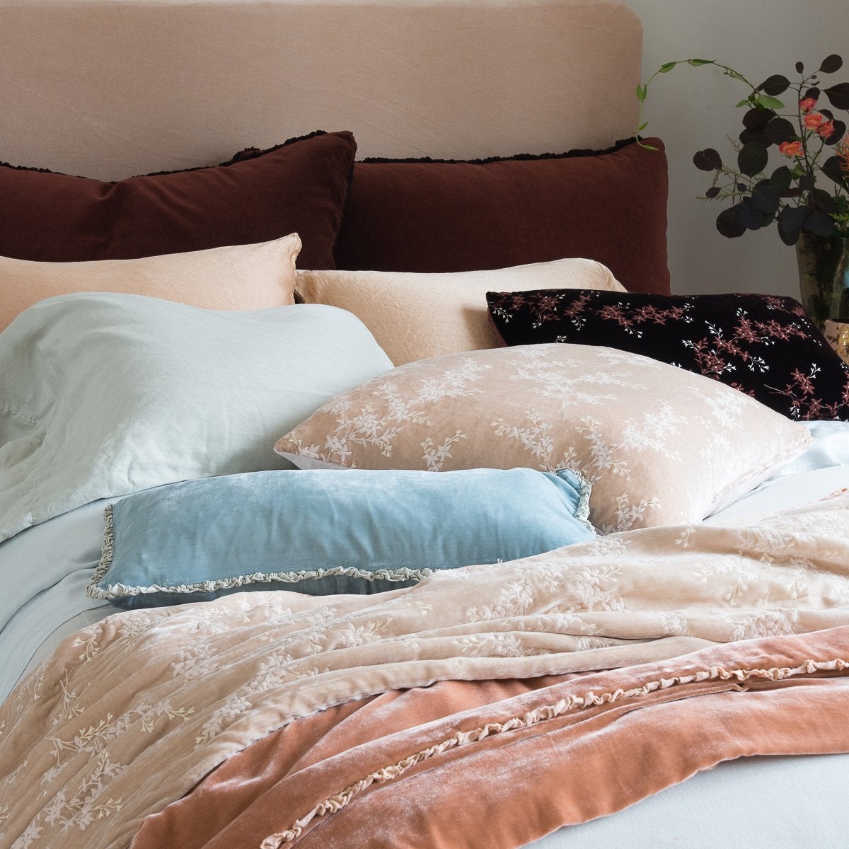 : Lynette 24 by 24 pillow in pearl, layered with soft pinks and blues, and rich browns in silk velvets, cotton velvets, and silk charmeuse - cropped three-quarter angle.