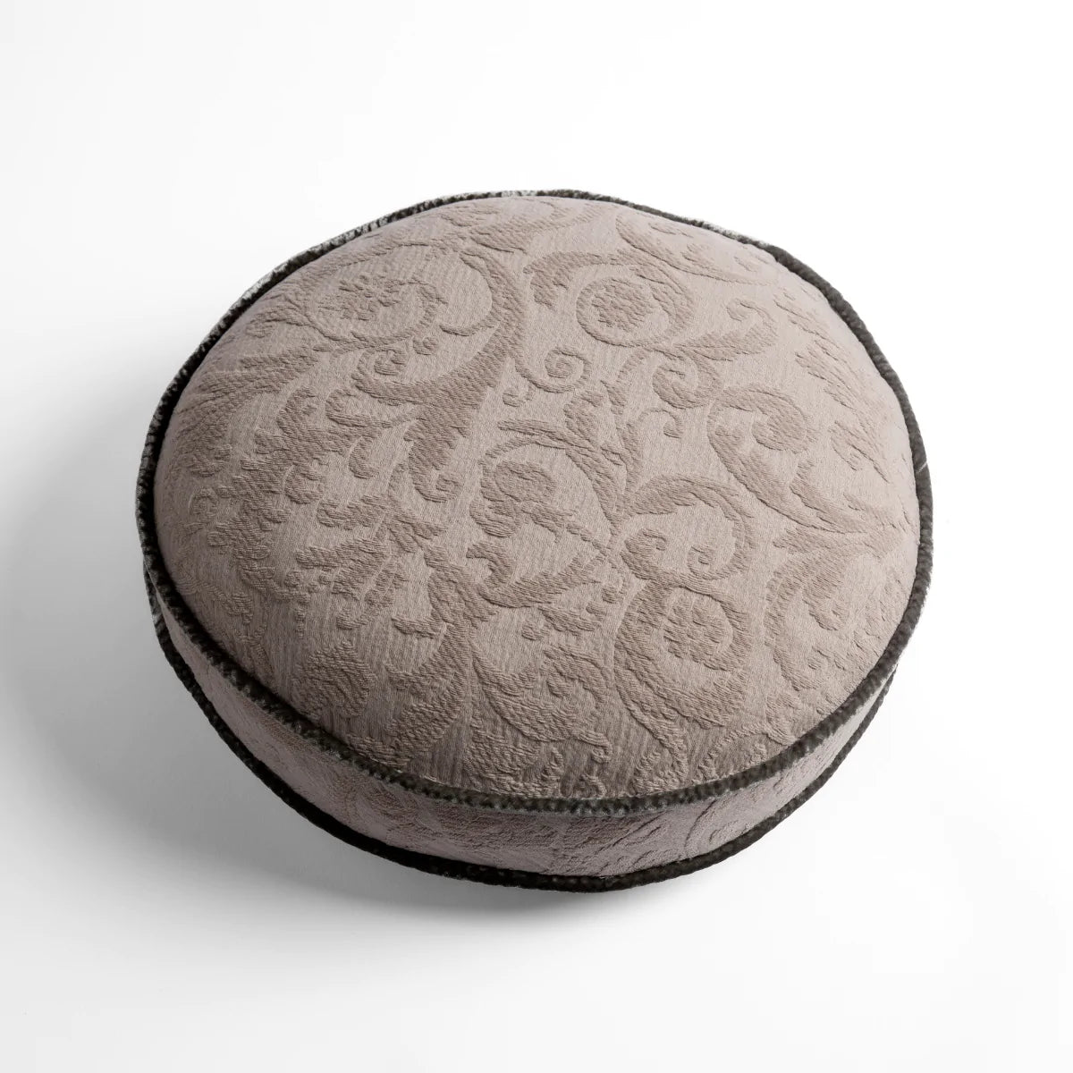 Fog: Organic cotton damask round pillow with silk velvet trim on white background — overhead angle.
