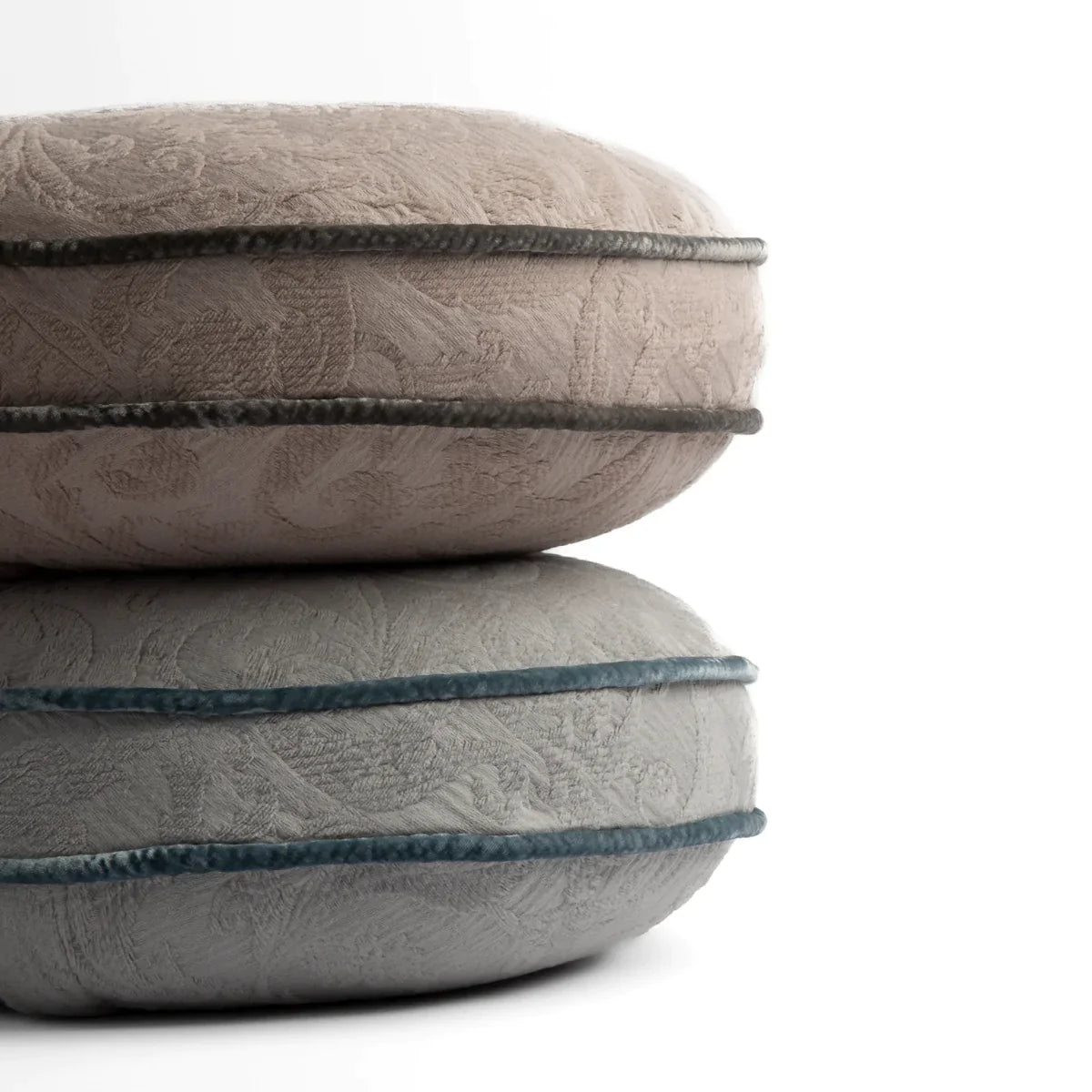 : Two 18 inch diameter throw pillows stacked against a white background. Pillows shown in Fog and Mineral. 