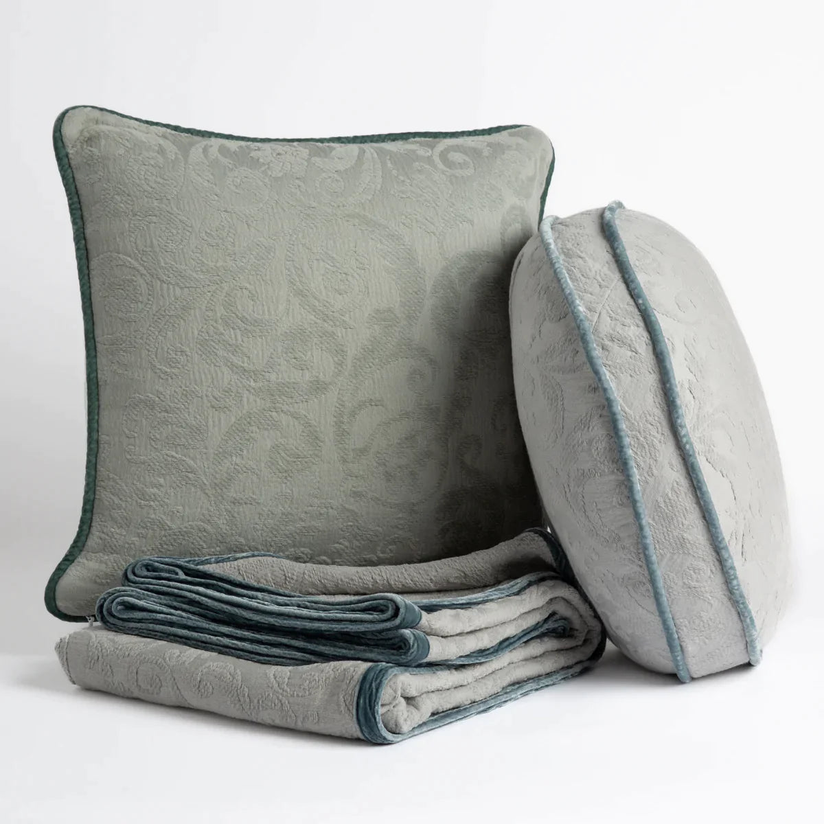 [allvariants]: Organic cotton damask throw pillows and throw blanket on a white background.