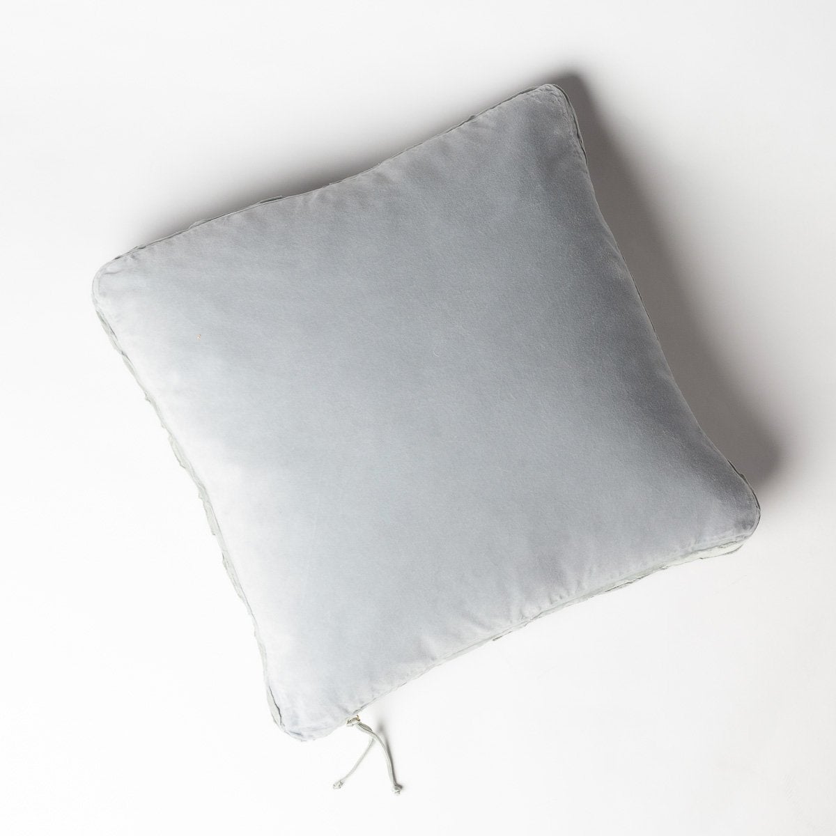Cloud: Cotton velvet 24 by 24 pillow on a plain background - overhead view.