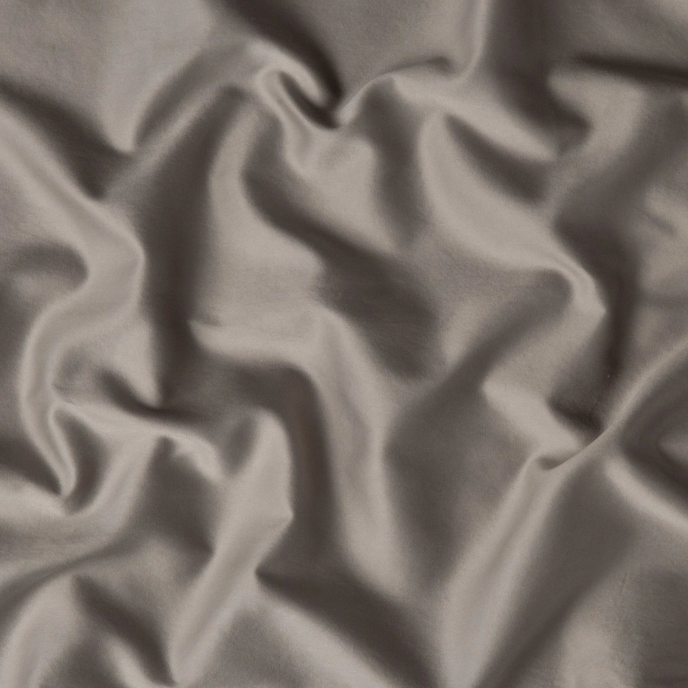Fog: A close up of cotton sateen fabric in fog, a neutral-warm, soft mid-tone grey.