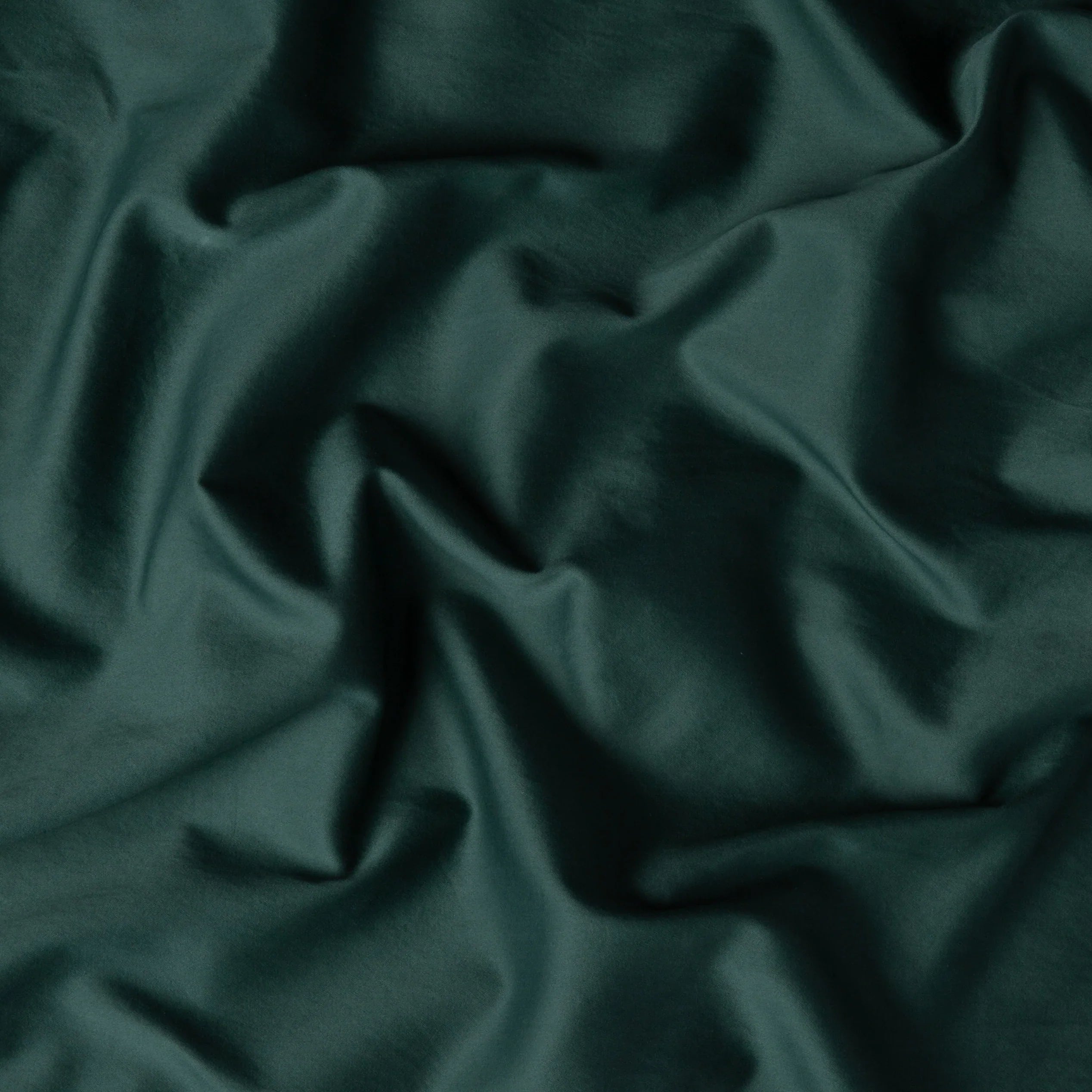 Jade: A close up of cotton sateen fabric in jade, a rich, verdant green with subtle blue undertones. 