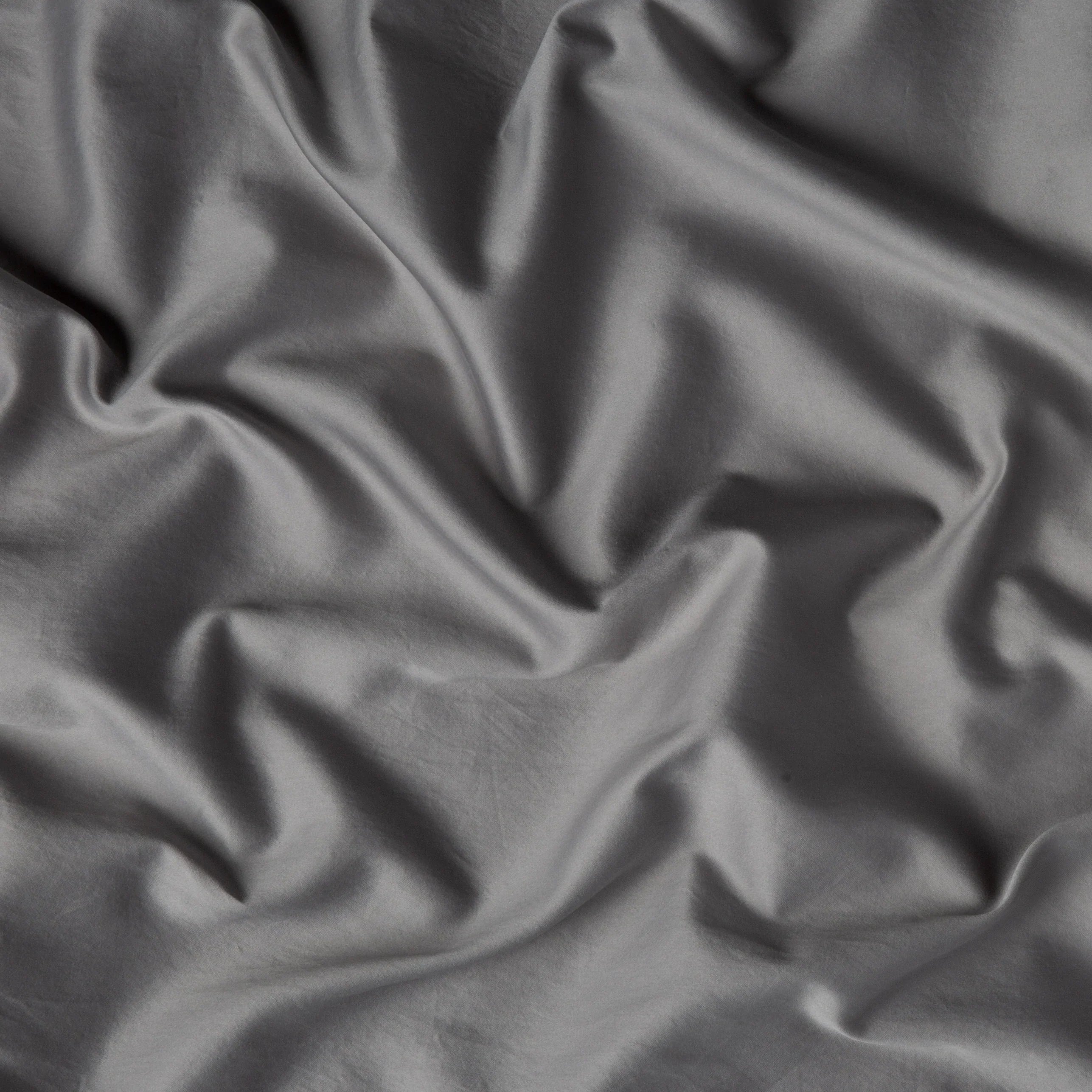 Moonlight: A close up of cotton sateen fabric in moonlight, a saturated, cool, mid-dark grey tone. 
