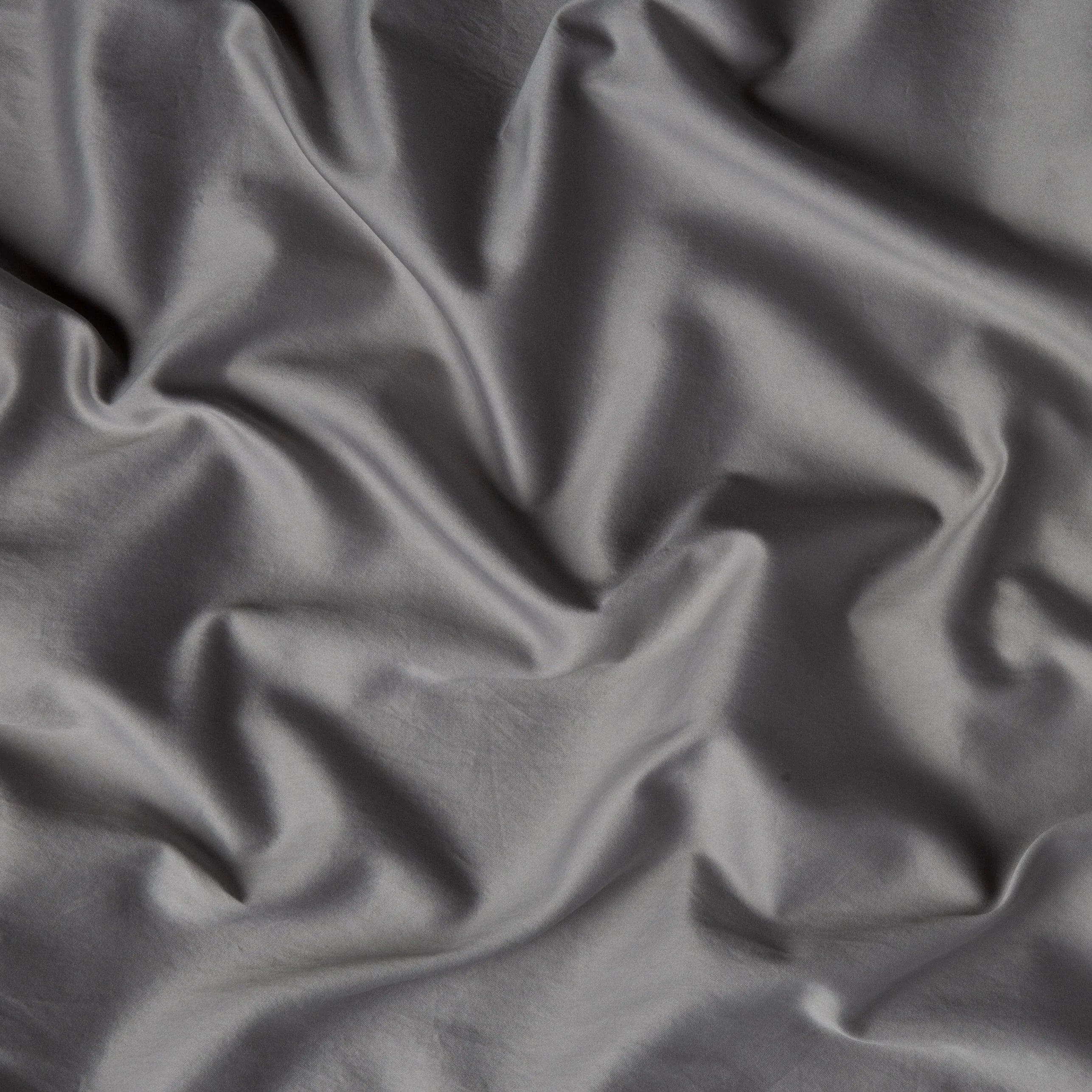 Moonlight: A close up of cotton sateen fabric in moonlight, a saturated, cool, mid-dark grey tone. 