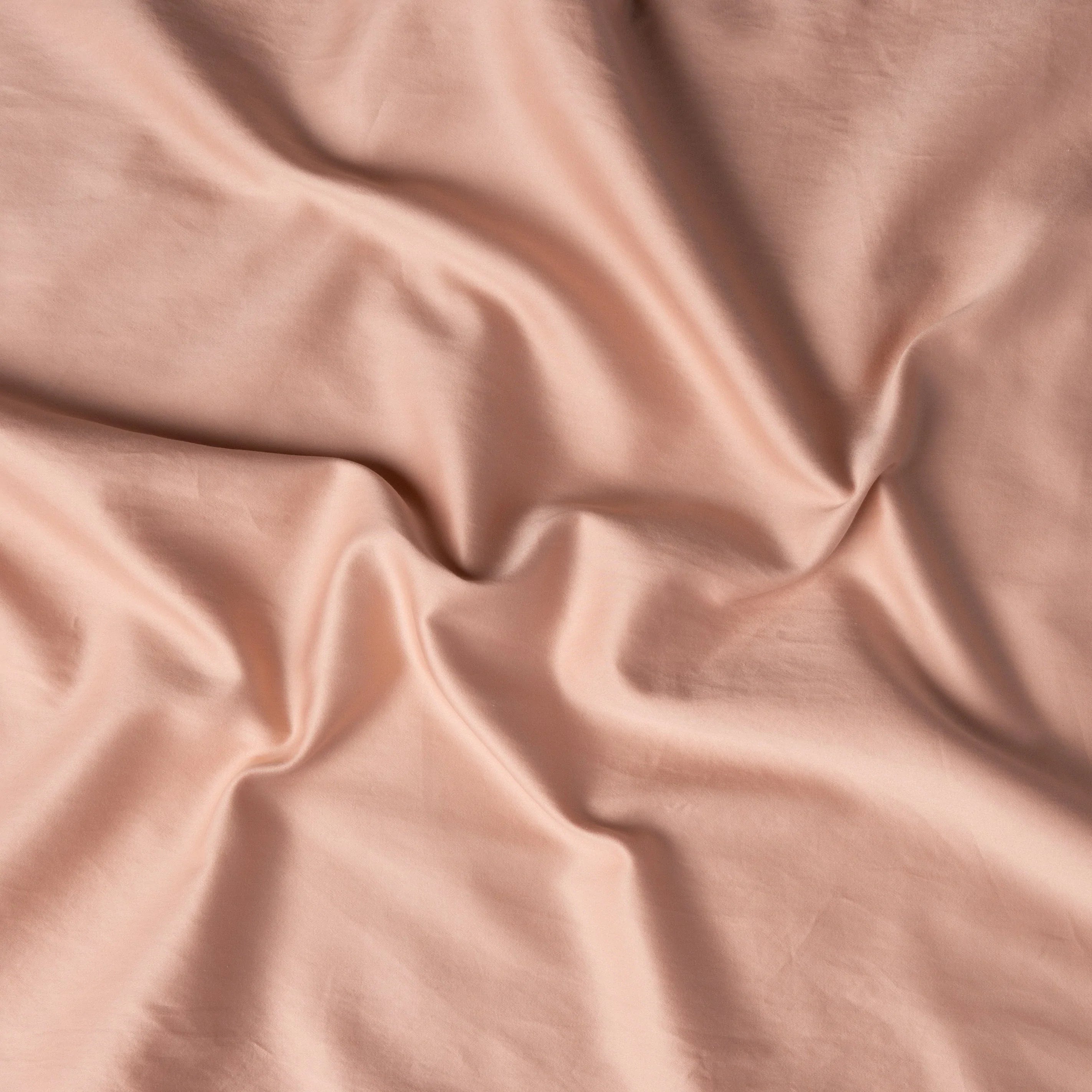 Rouge: A close up of cotton sateen fabric in rouge, a mid-tone blush pink. 