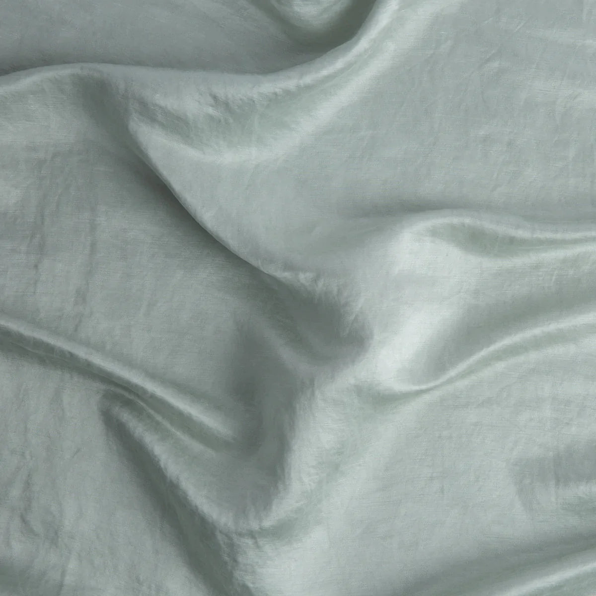 Cloud: Close-up of silk charmeuse in cloud, a soft, subtle sky blue-grey. 