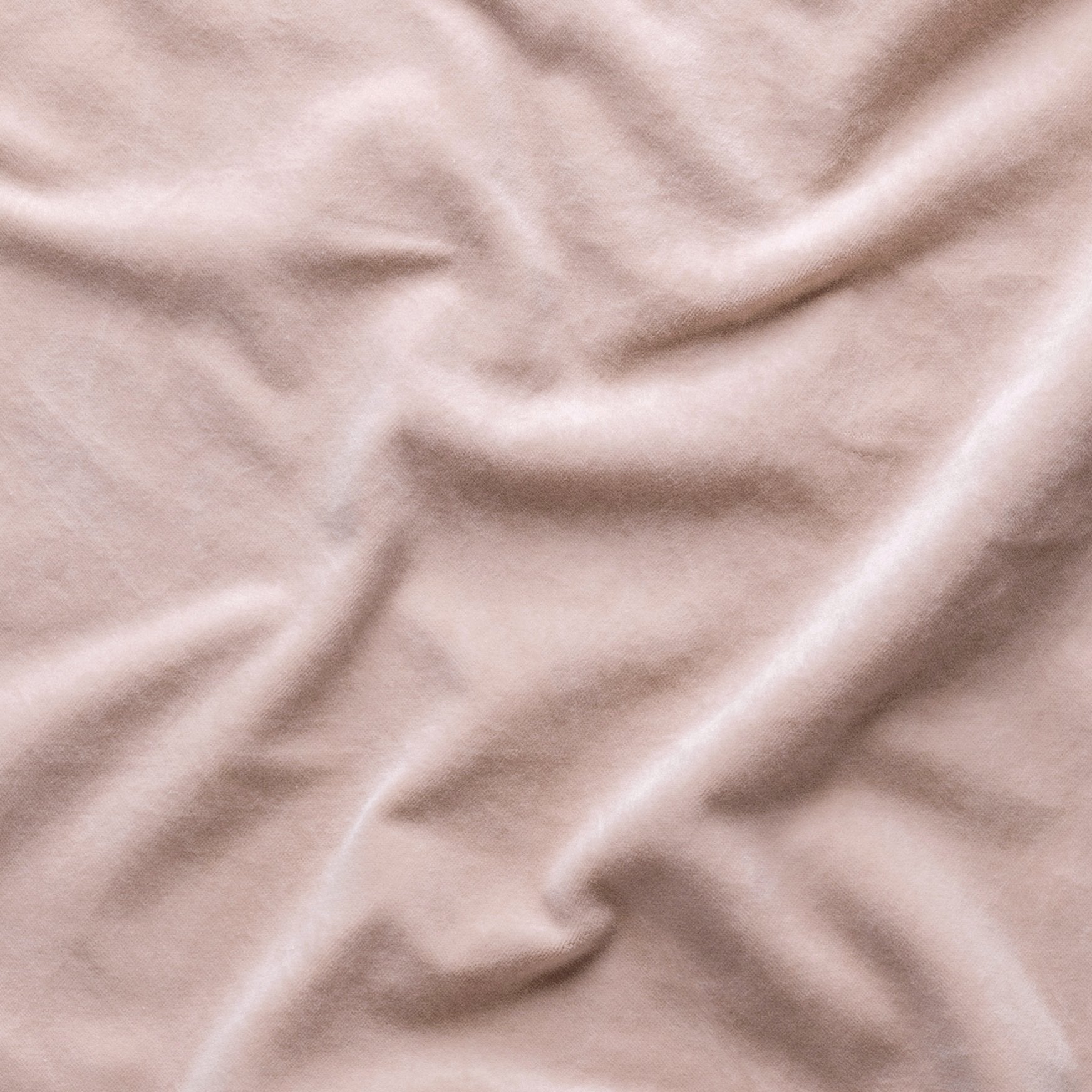 Pearl: A close up of cotton velvet in pearl, a nude-like, soft rose pink tone. 