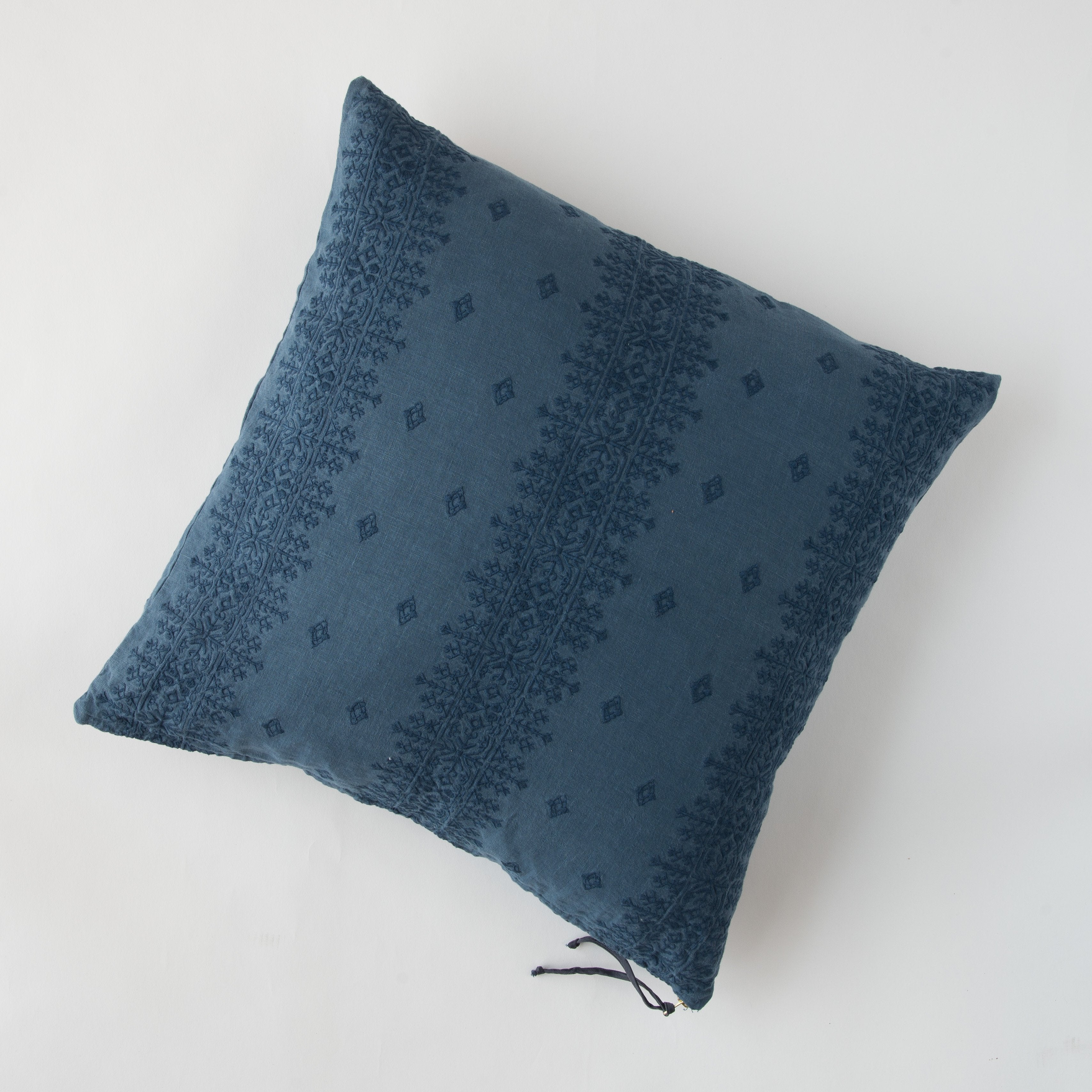 Midnight: pillow on a white background - overhead view.
