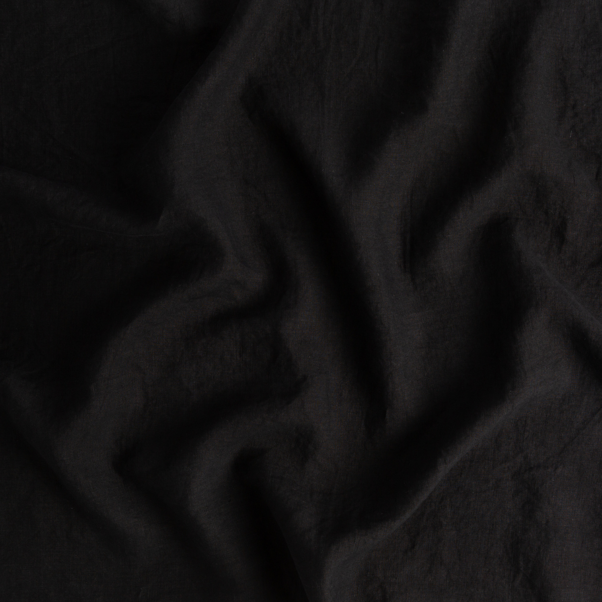Corvino: A close up of linen fabric in Corvino, a black tone