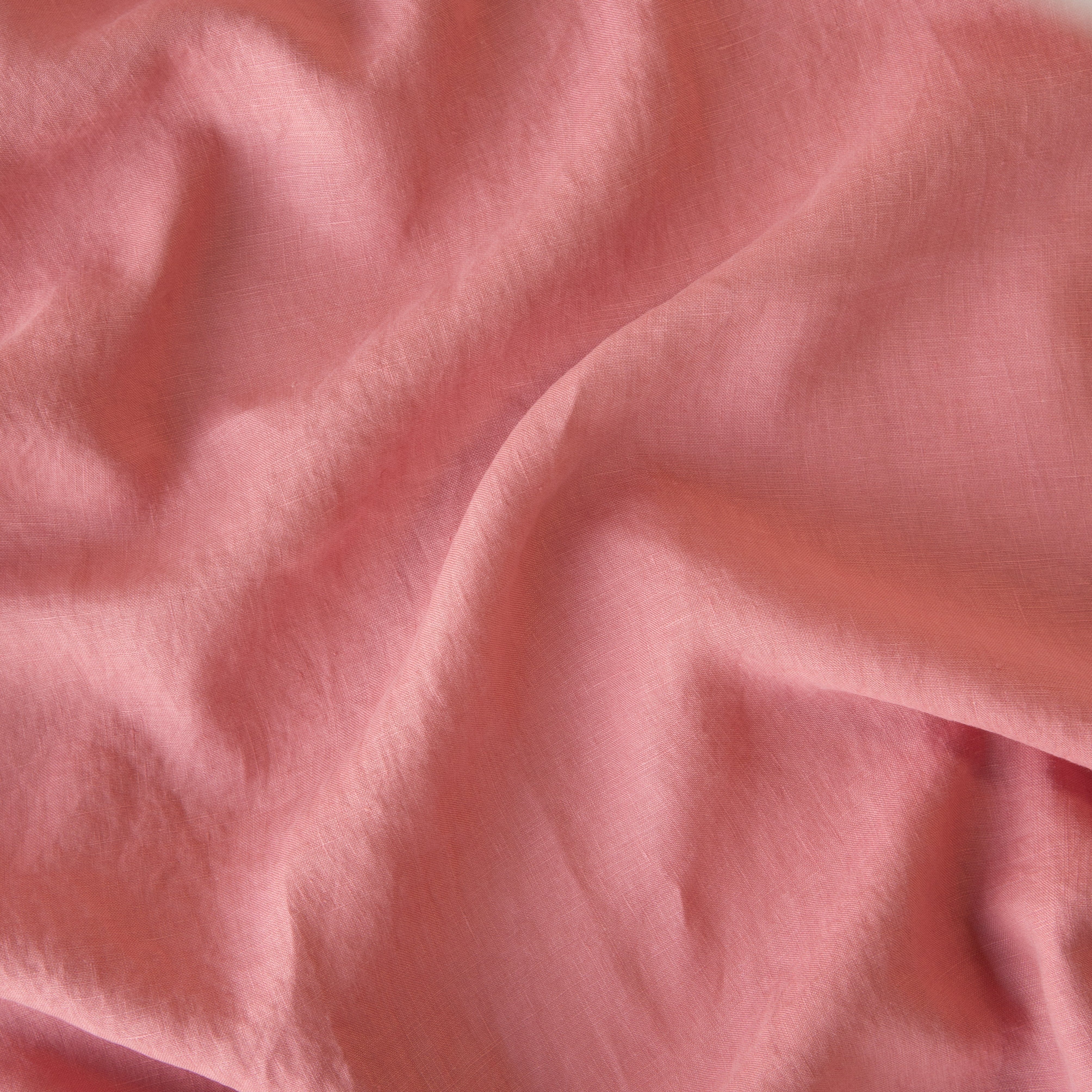 Poppy: A close up of linen in poppy, a warm coral pink.