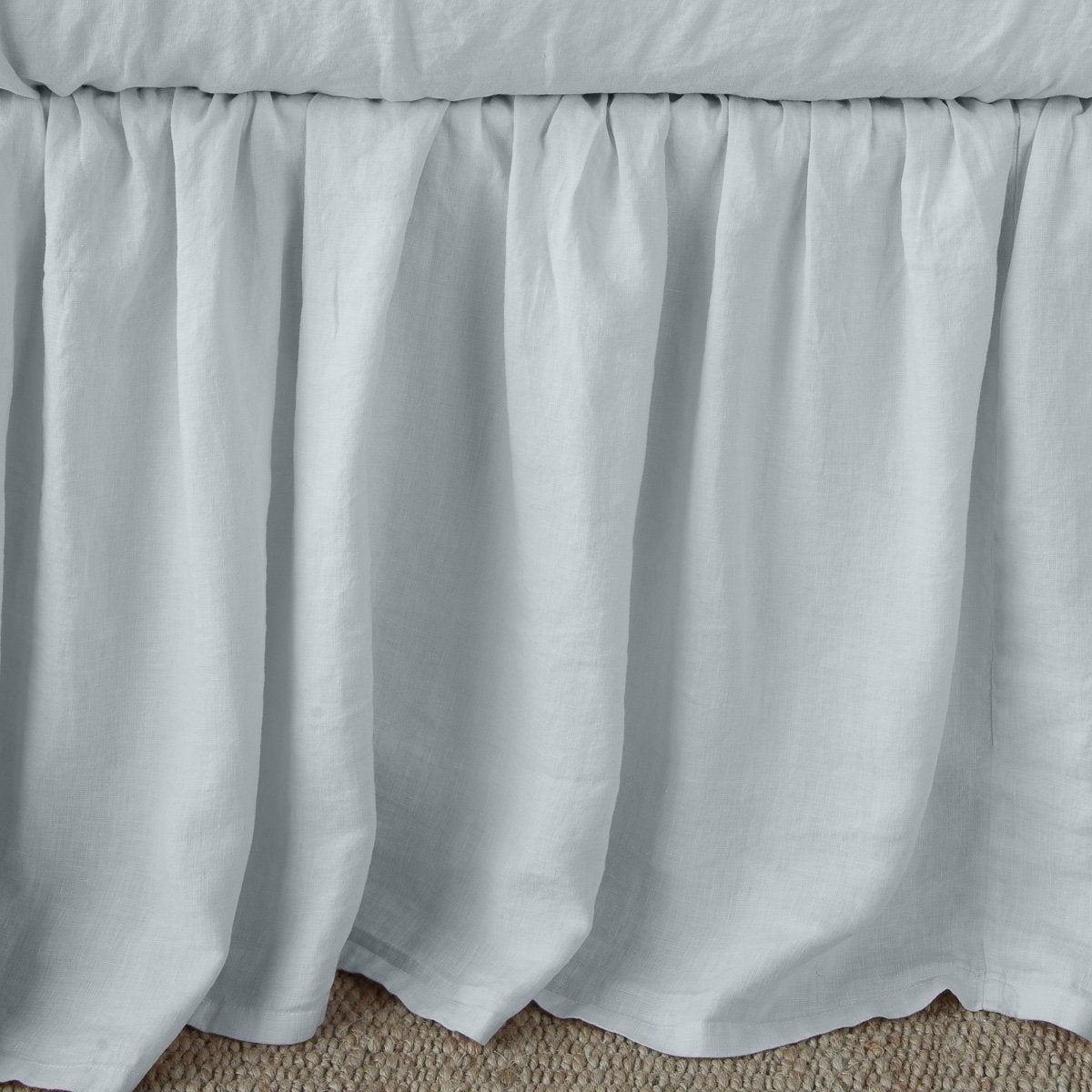 Cloud: Close-up of bed skirt, featuring its softly gathered design.
