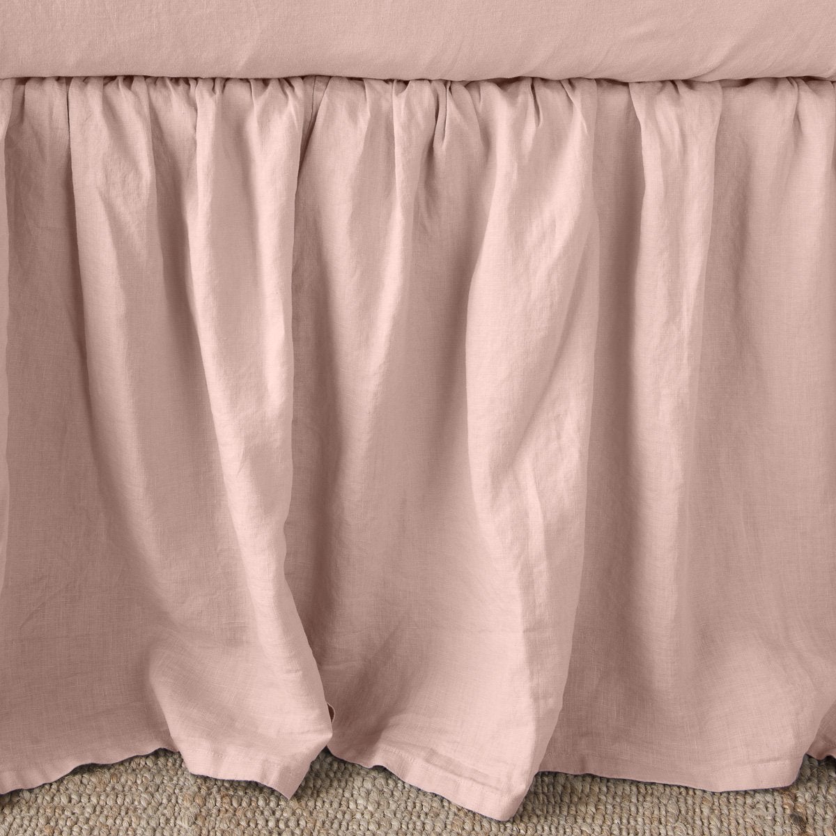 Rouge: Close-up of bed skirt, featuring its softly gathered design.