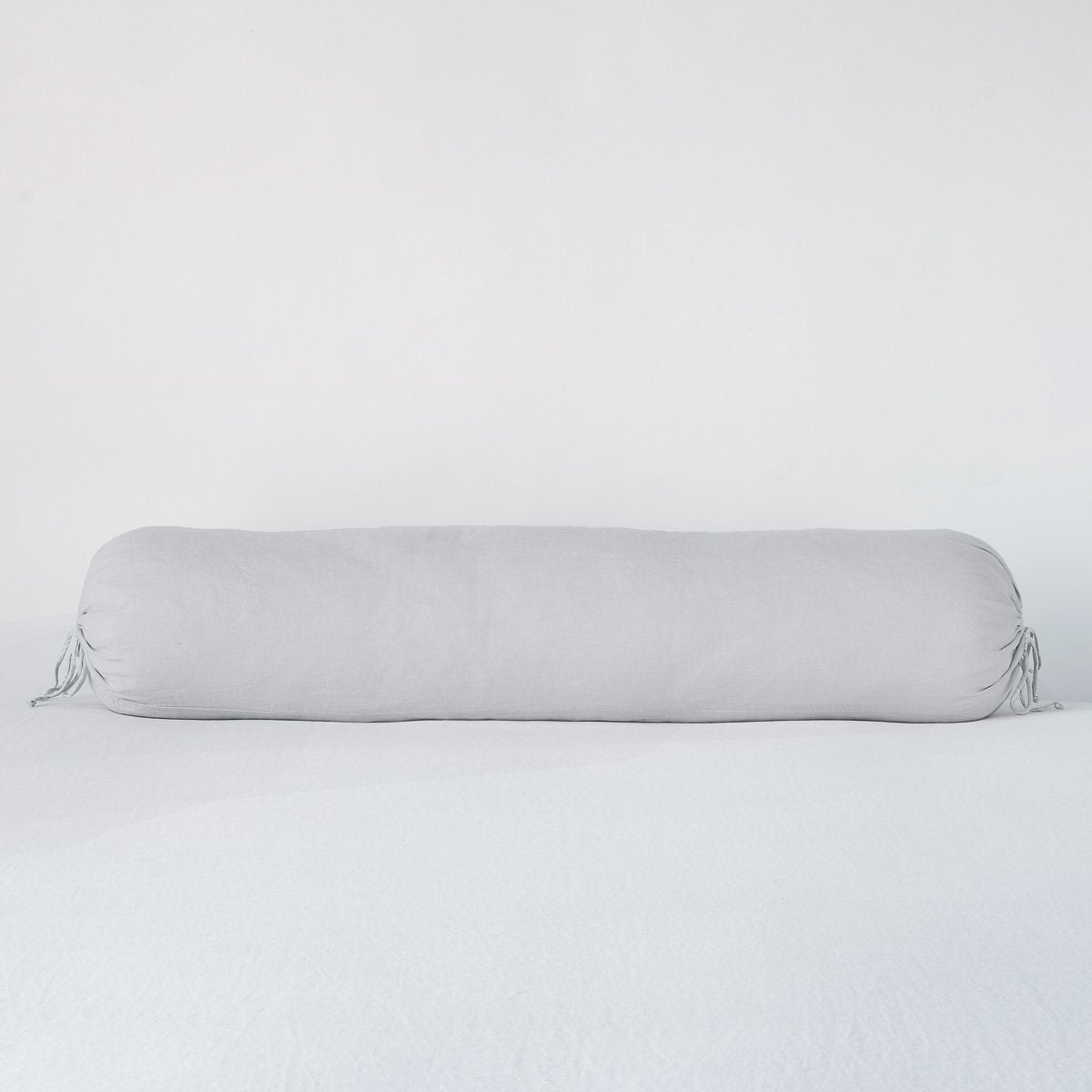 Sterling: Linen bolster in sterling against a plain background.
