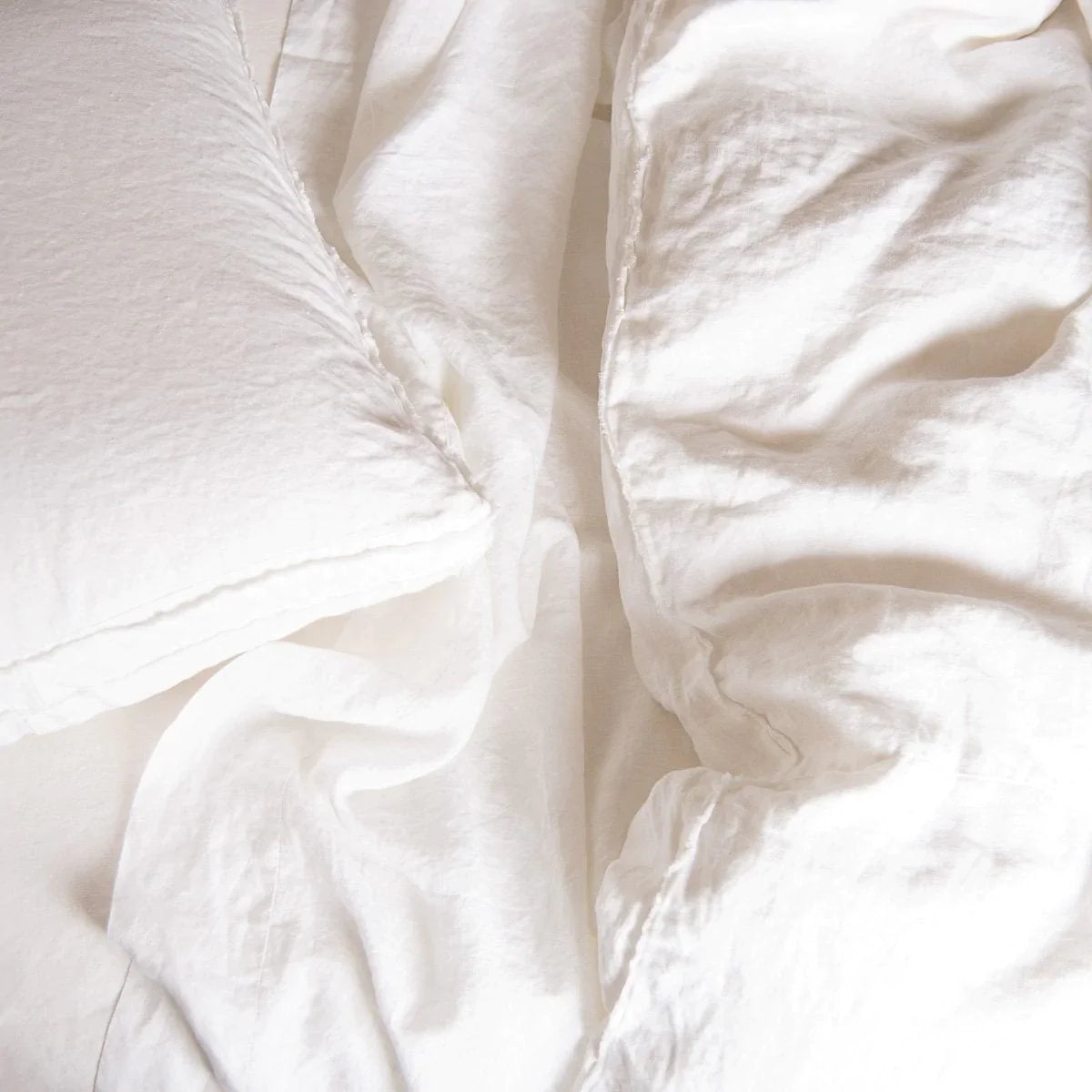 : Linen sheeting with Austin midweight linen duvet and sham, white - overhead view.