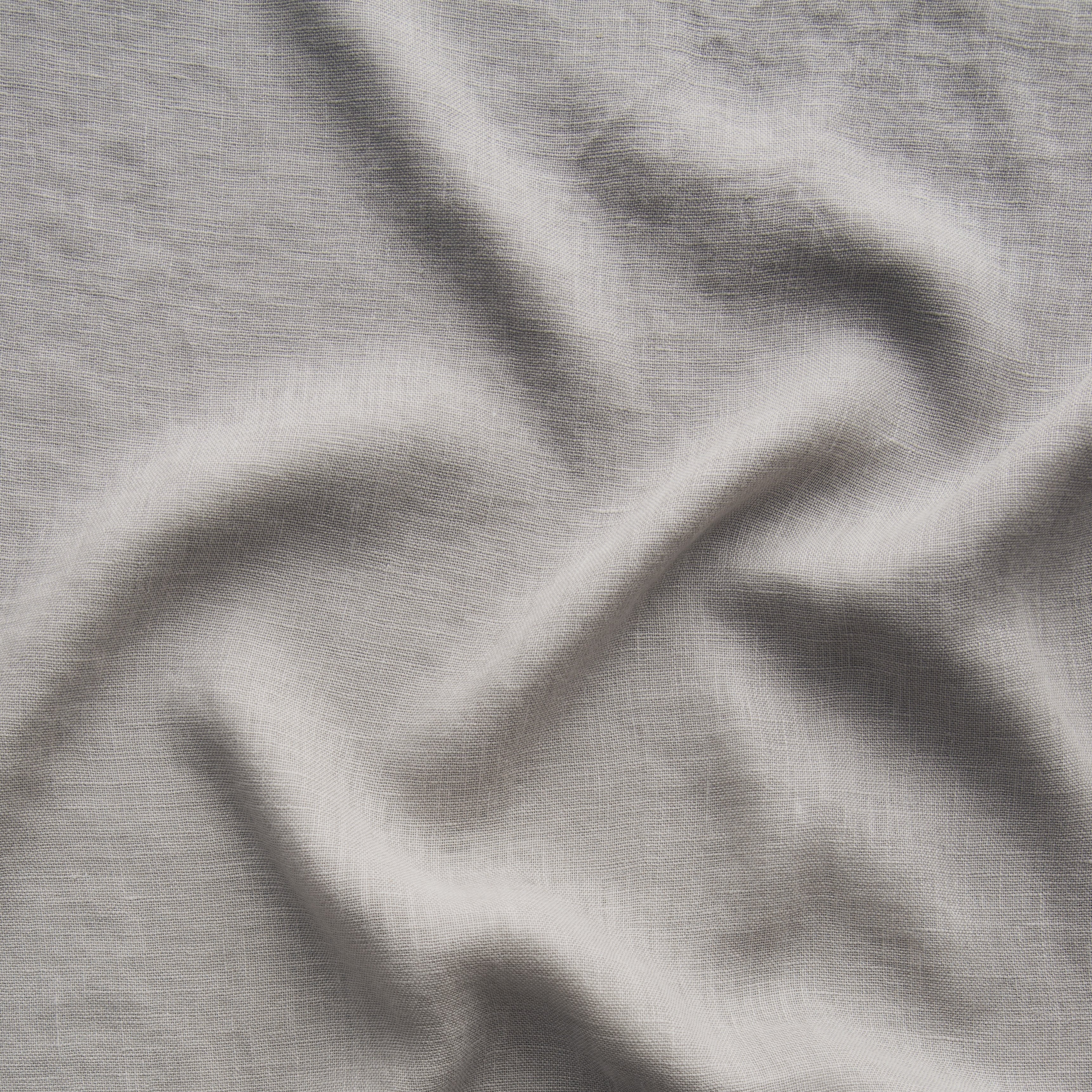 Fog: A close up of linen whisper, our lightweight linen gauze, in fog, a neutral-warm, soft mid-tone grey. 