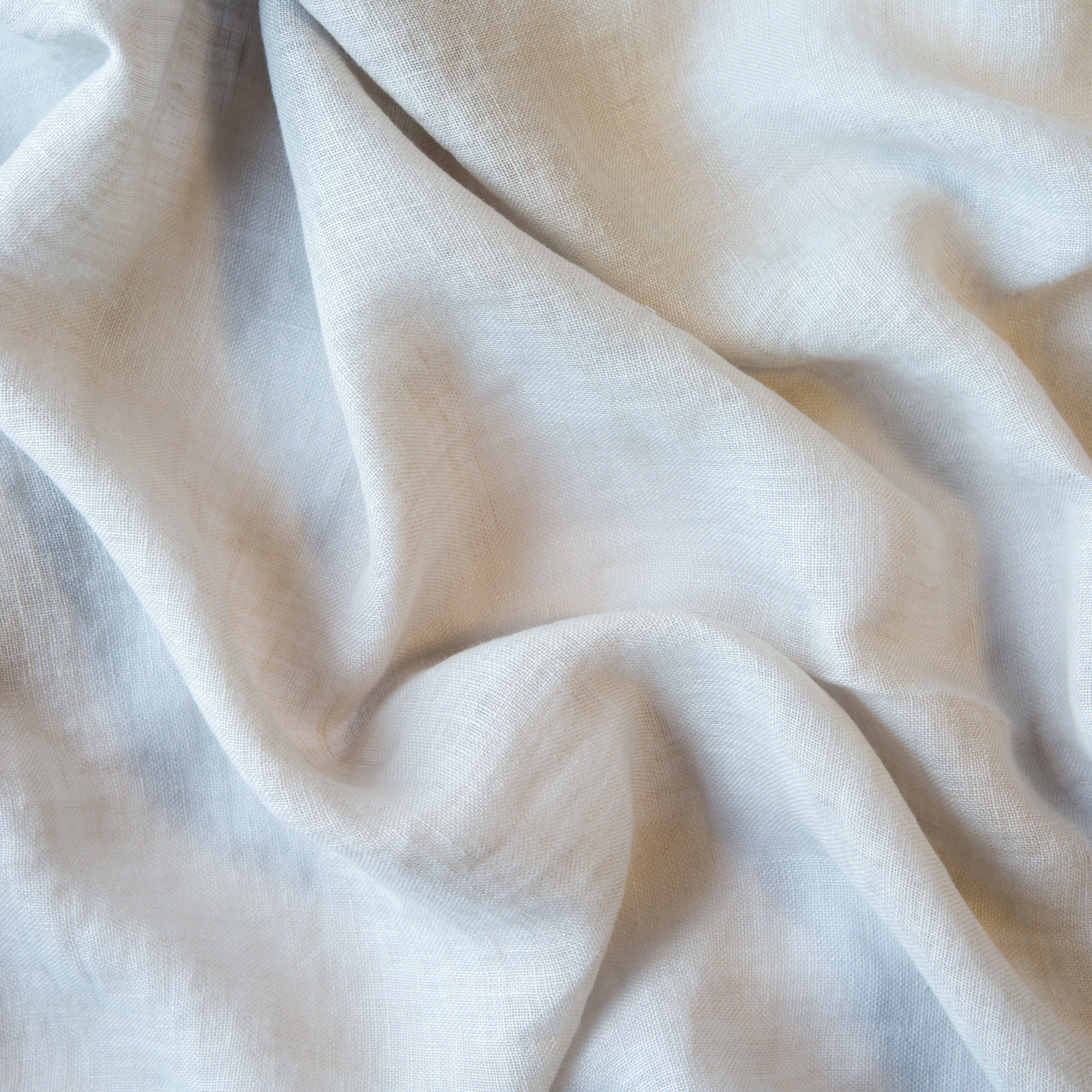 Sterling: A close up of linen whisper, our lightweight linen gauze, in sterling, a silvery neutral light grey. 