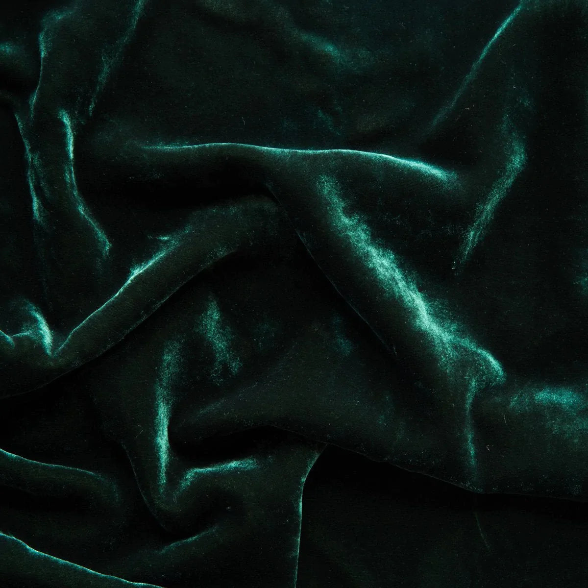 Jade: A close up of silk velvet in jade, a rich, verdant green with subtle blue undertones. 