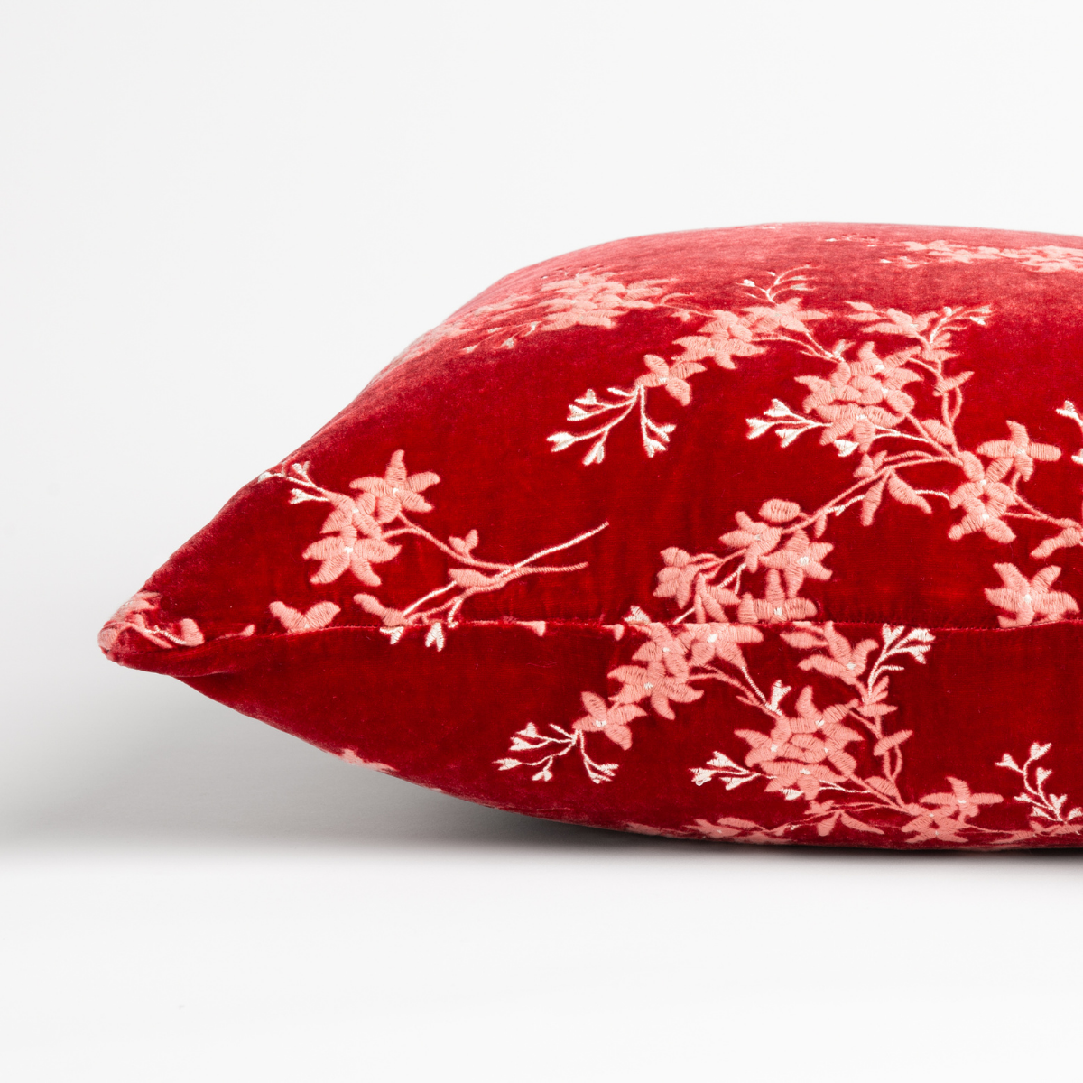 Poppy: side view of pillow showing front and back, straight on against a white background.