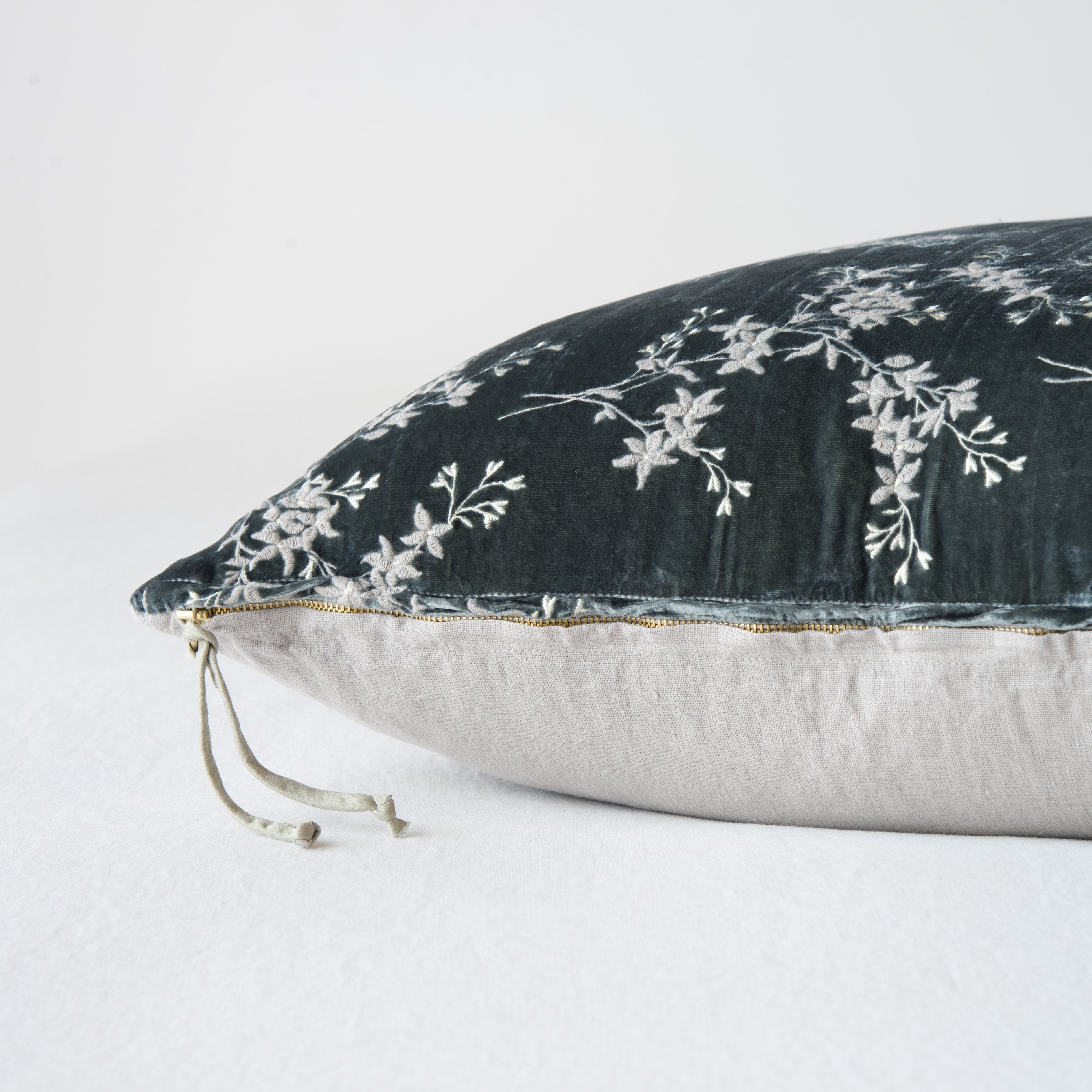 Fog: Close-up side vew featuring brass zipper with charmeuse pull and linen back.