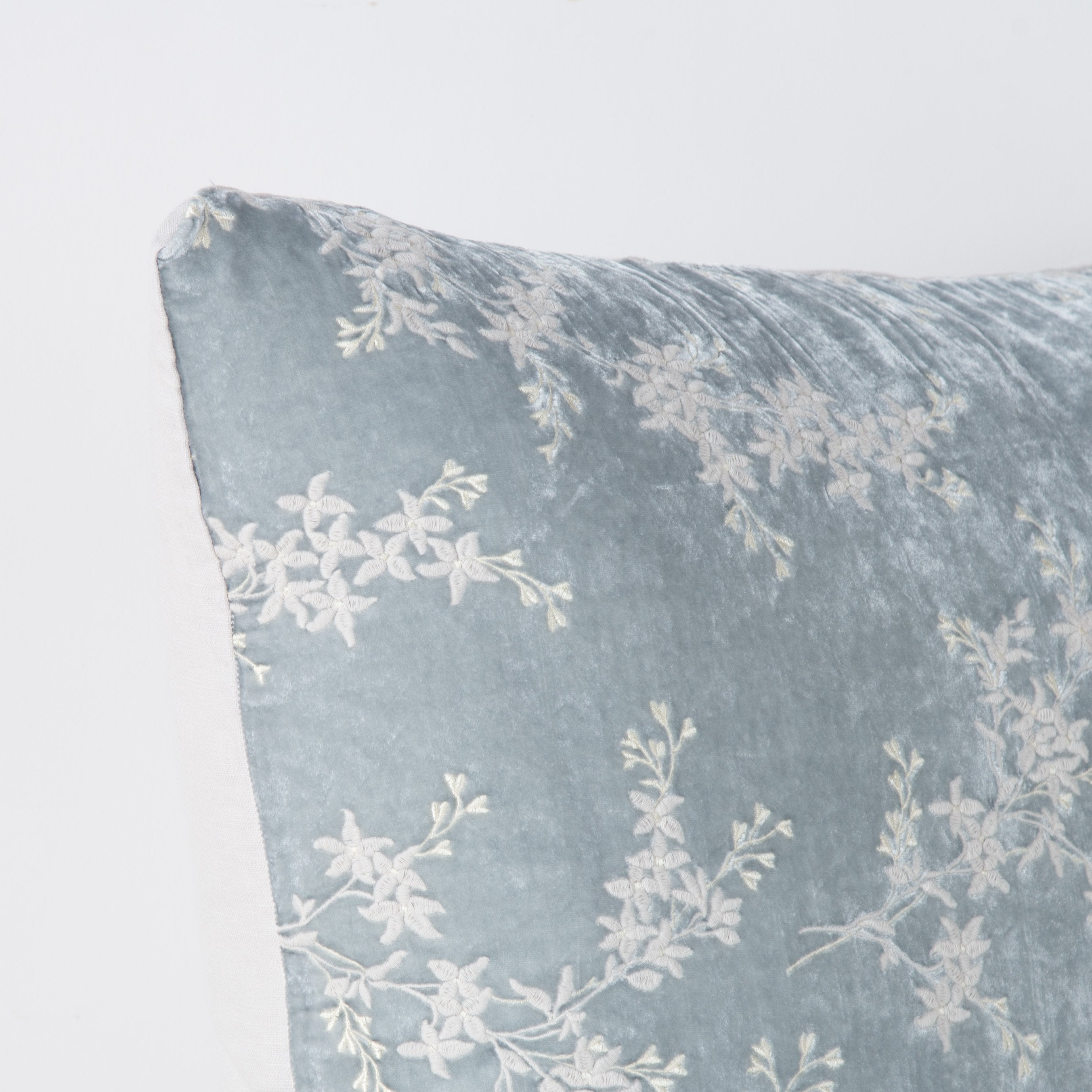 Sterling: Corner detail close-up, highlighting two-tone embroidery and linen back.
