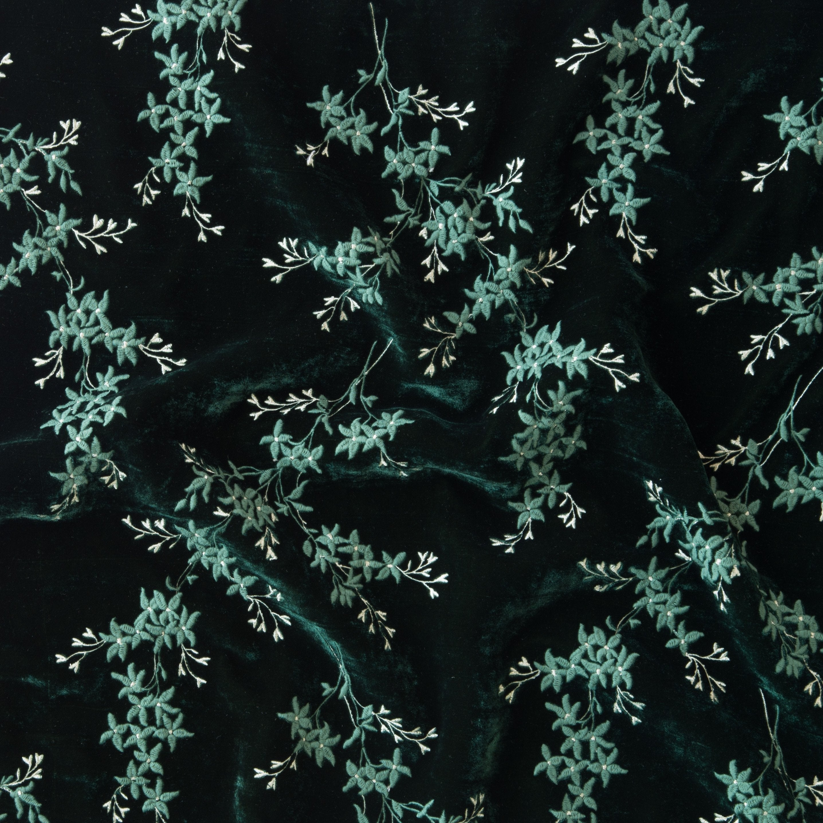 Jade: A close up of Lynette embroidered silk velvet, in jade, a rich, verdant green with subtle blue undertones. 