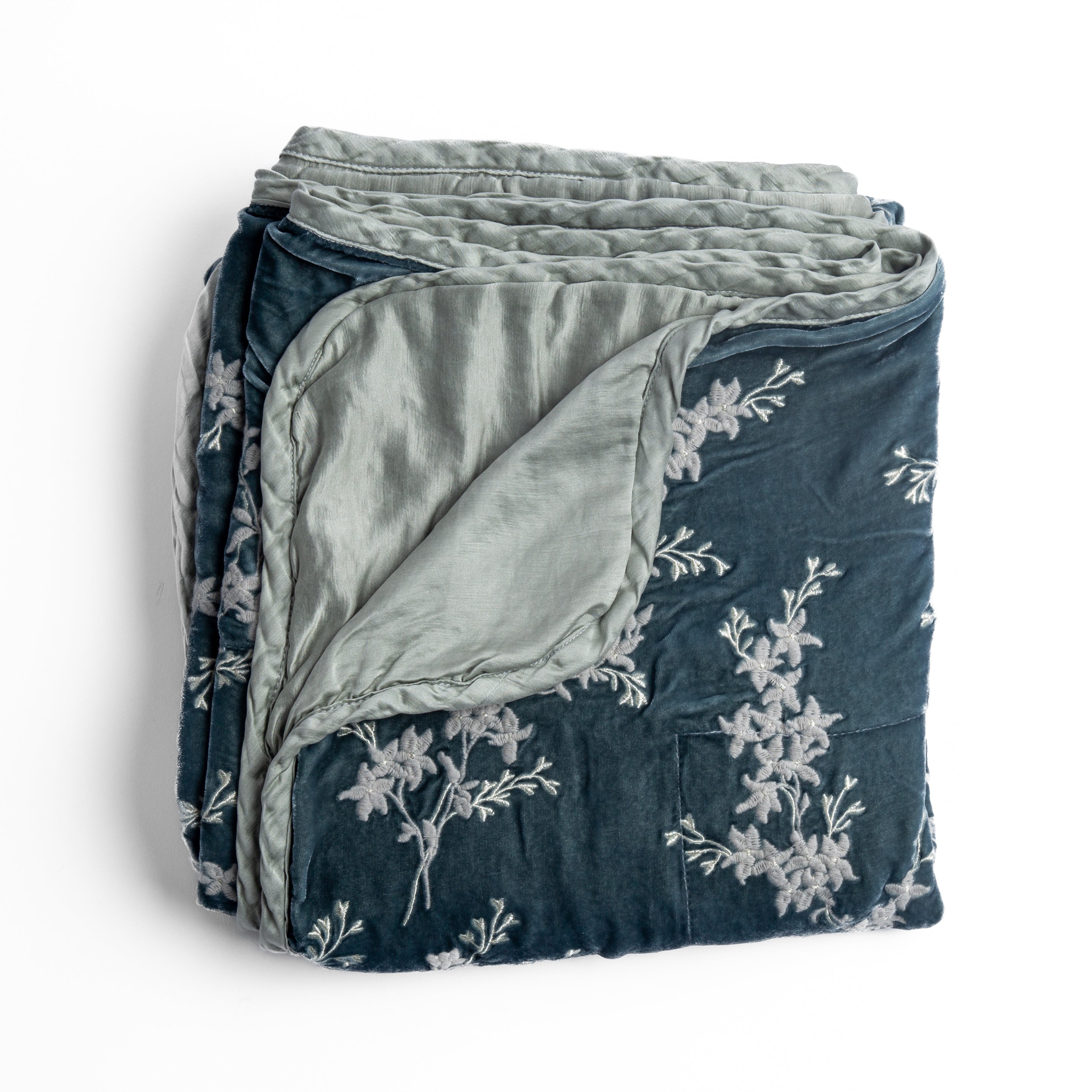 Mineral: overhead angle of the folded blanket with a corner pulled back to show the reverse and trim. 