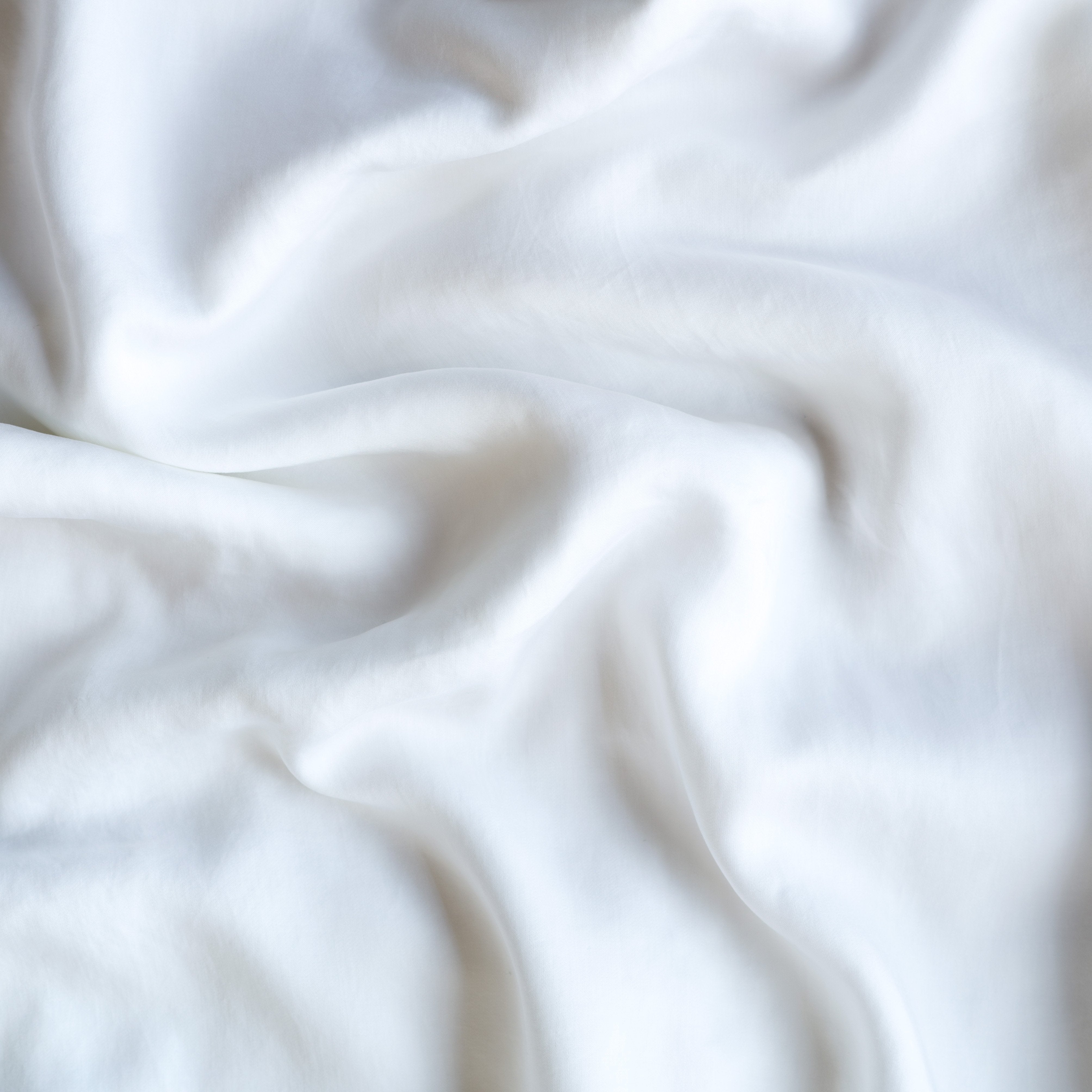 White: A close up of Tencel™ fabric in white.