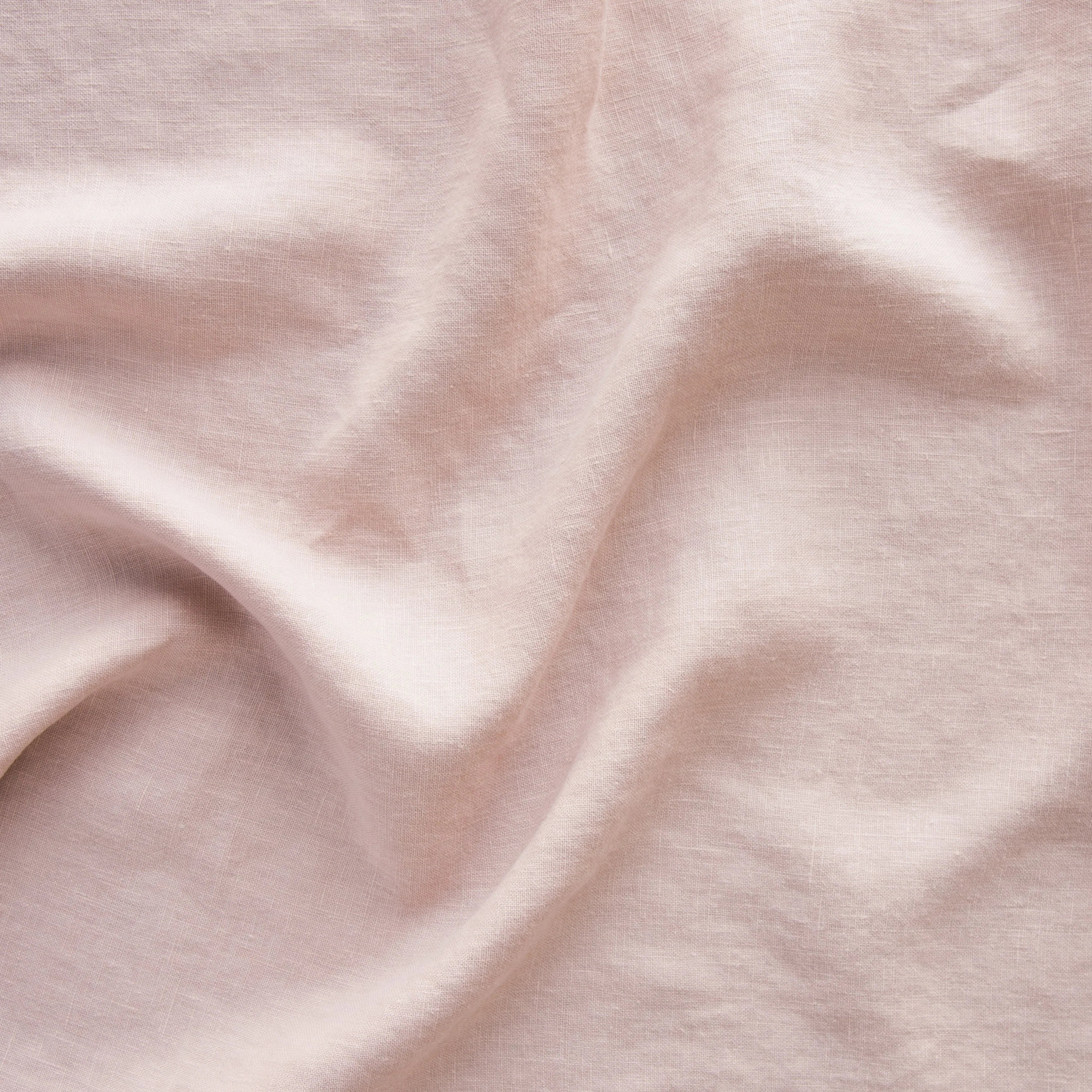 Rouge: A close up of midweight linen in rouge, a mid-tone blush pink. 