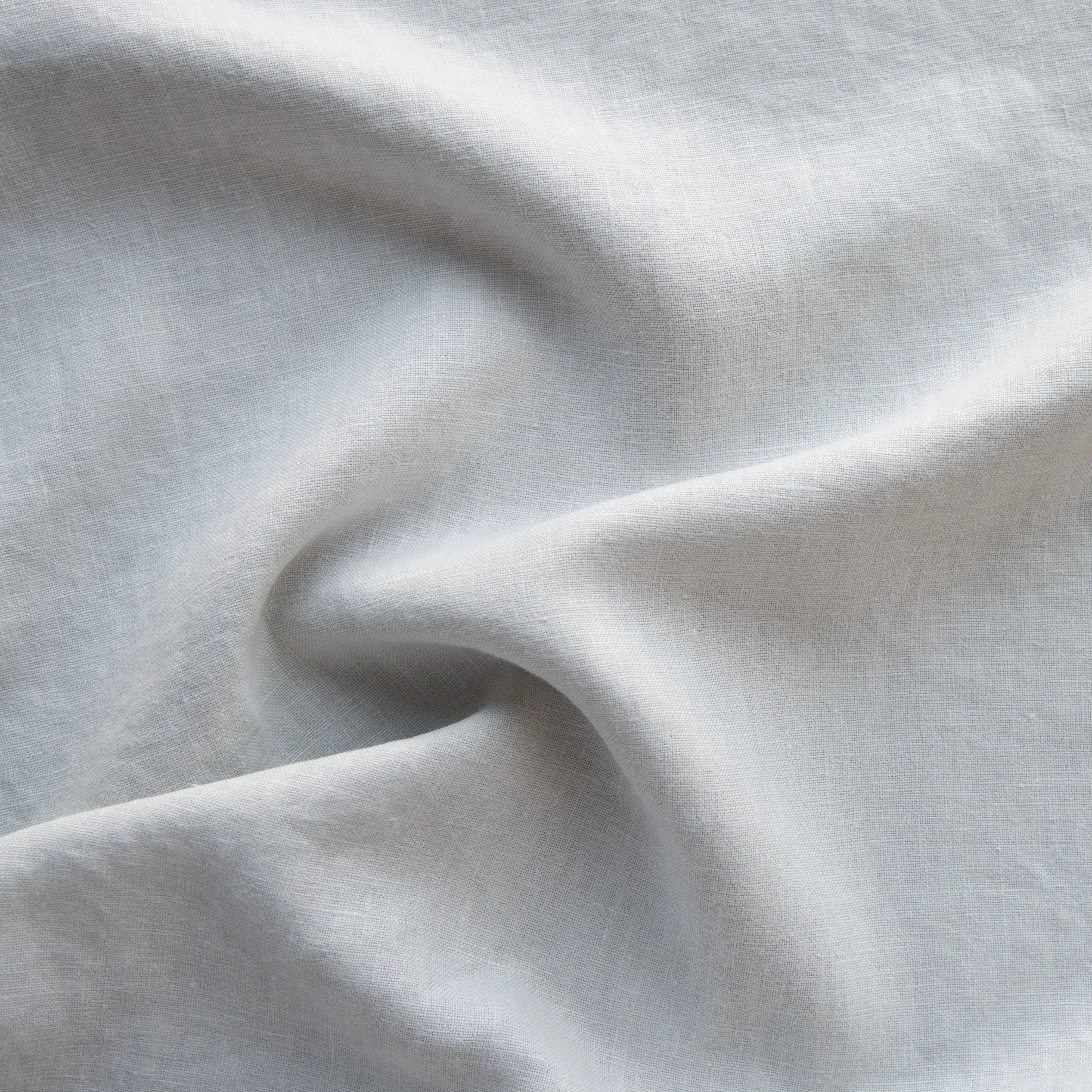 Sterling: A close up of midweight linen in sterling, a silvery neutral light grey. 