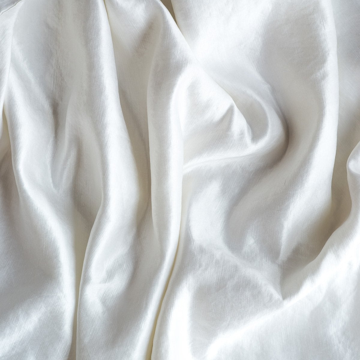 White: Close-up of silk charmeuse in white.