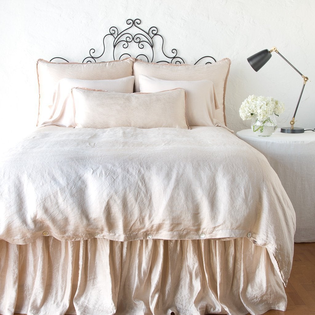 : Paloma bed skirt with matching duvet, and pillows - pearl, end of bed view.