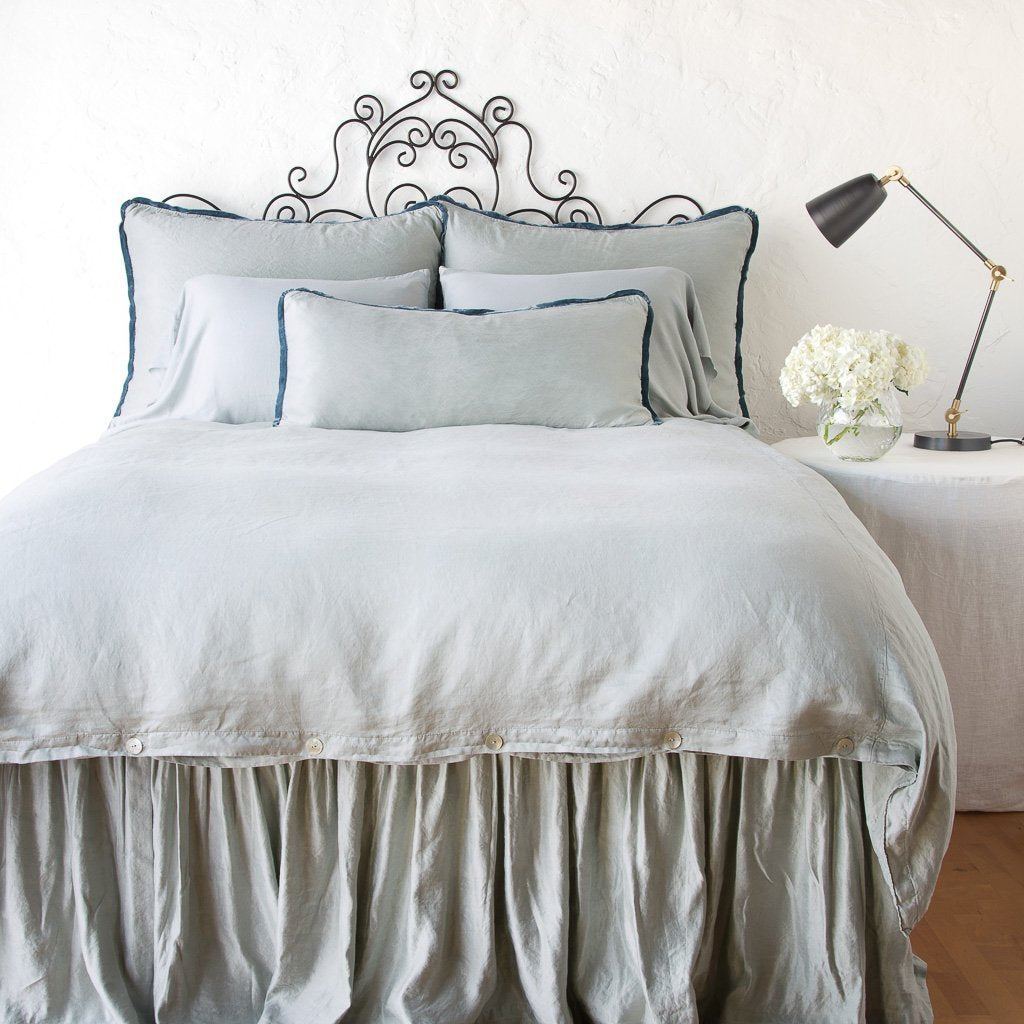 Mineral: duvet cover with matching pillows and bed skirt - end of bed view.