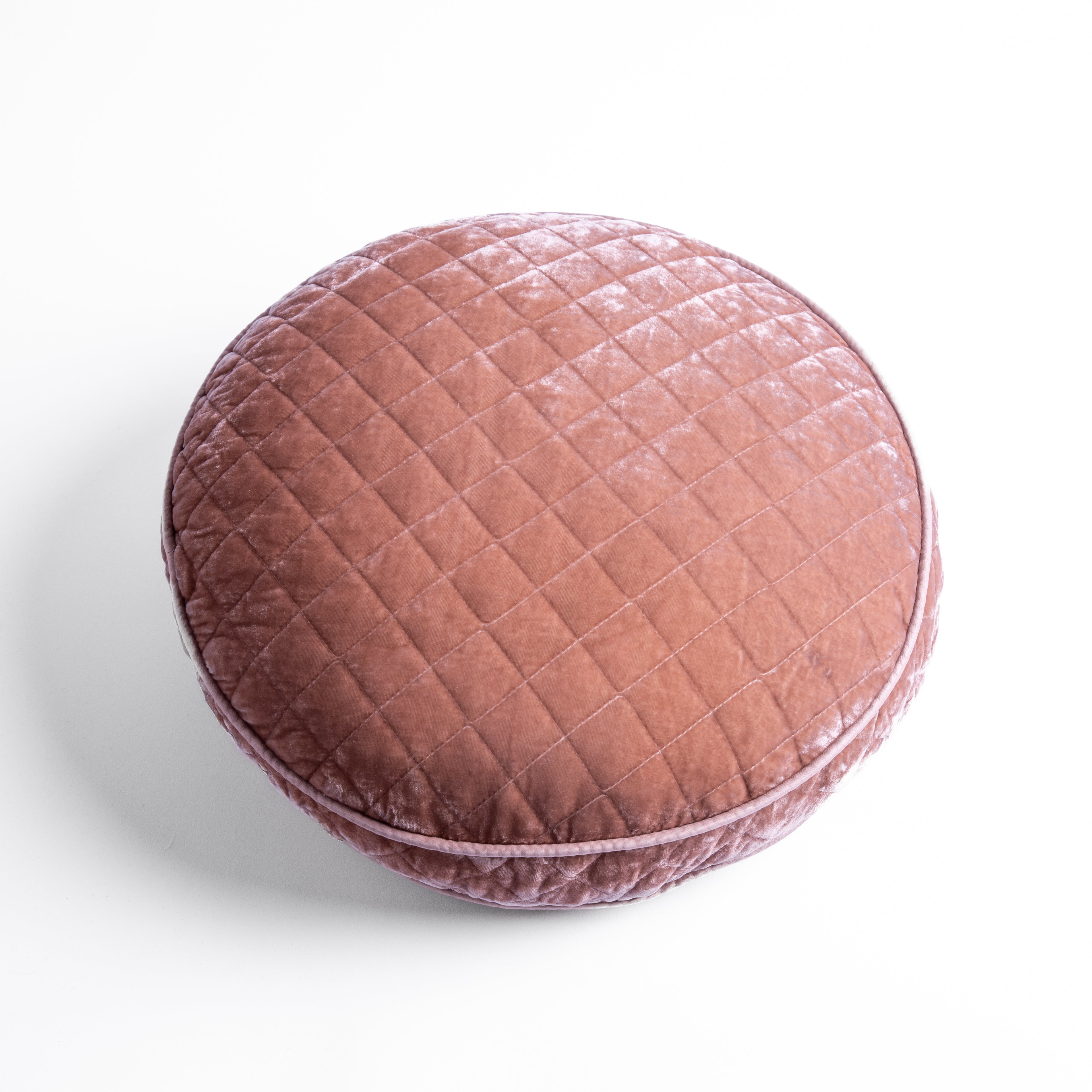 Rouge: overhead at a slight angle against a white background, the face and gusset of the pillow are visible.