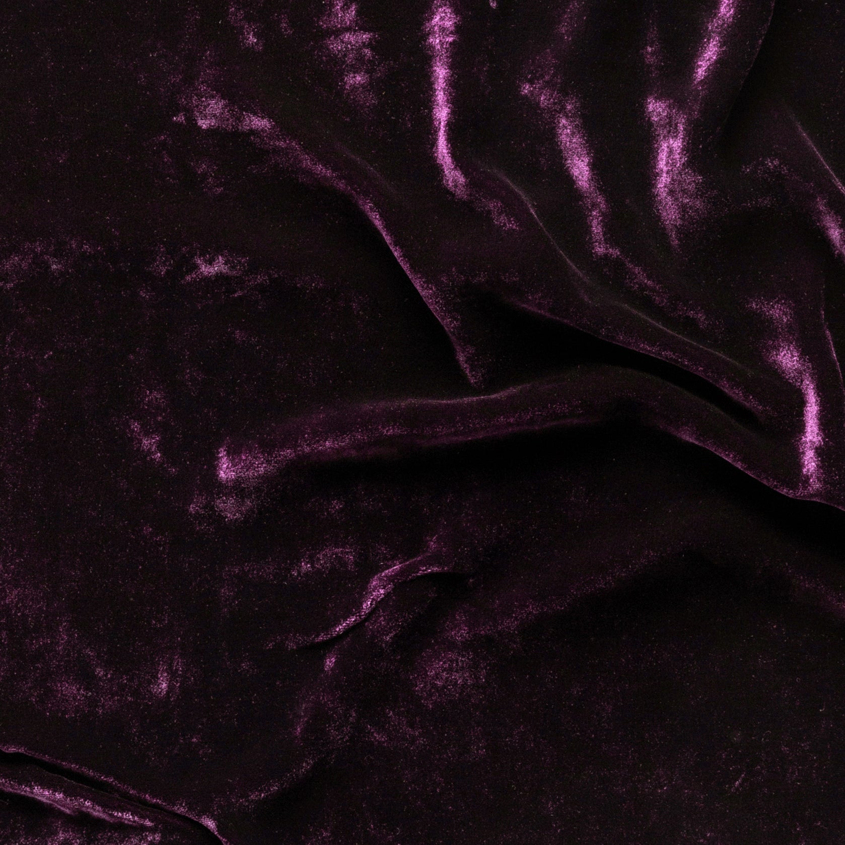 Fig: A close up of silk velvet in fig, a richly saturated purple-garnet. 