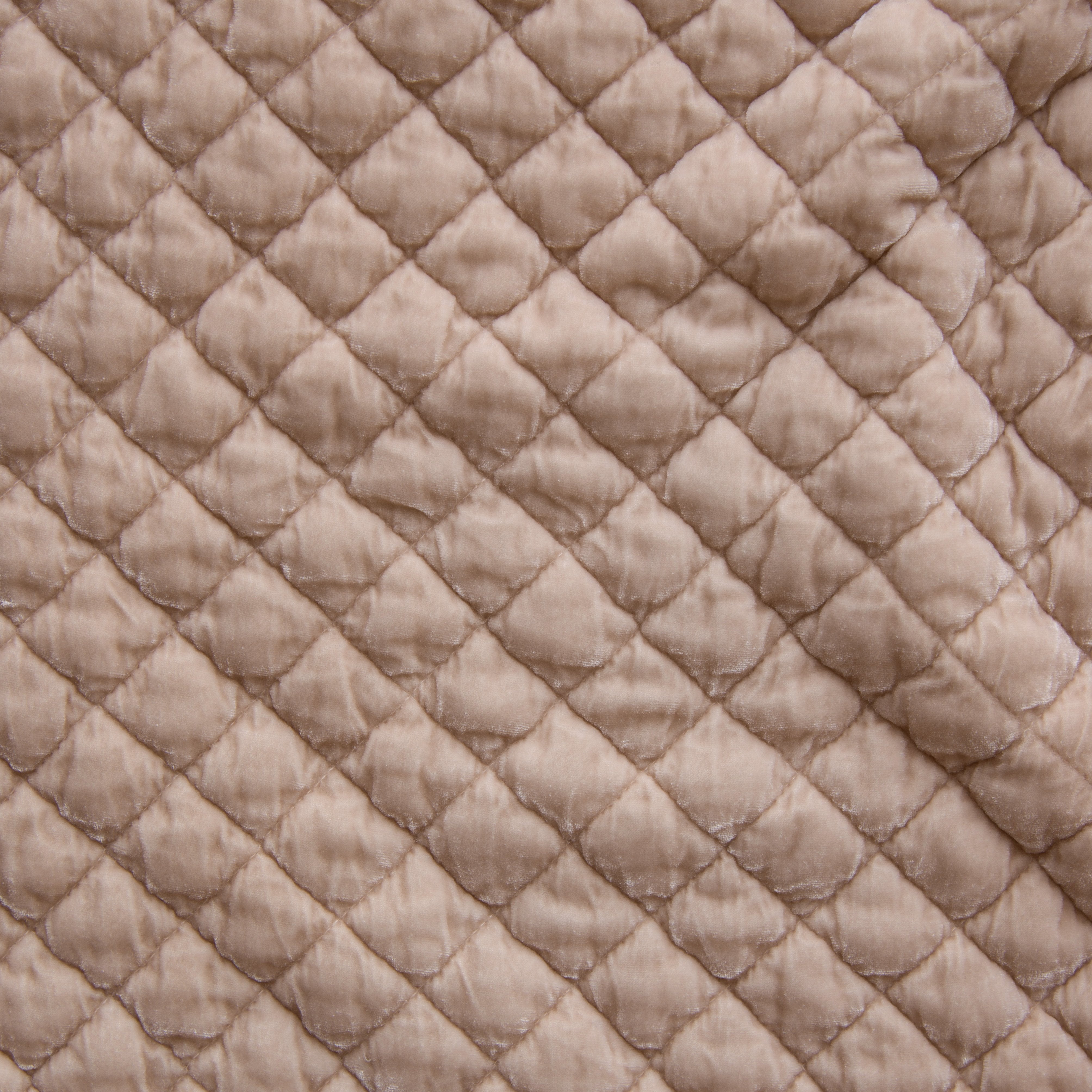 Pearl: Close-up of quilted silk velvet in pearl, a nude-like, soft rose pink tone. 