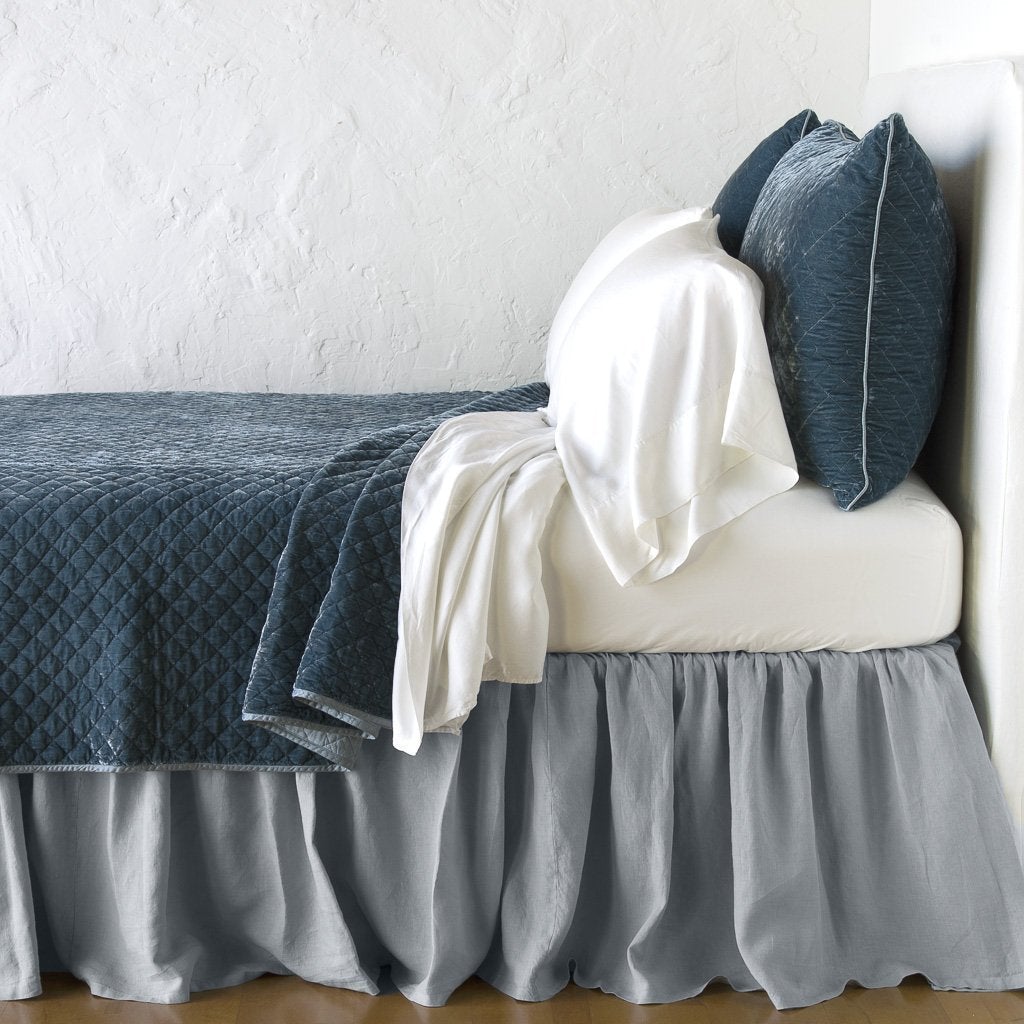 : Silk velvet quilted shams with matching coverlet and white sheeting - mineral, side view.