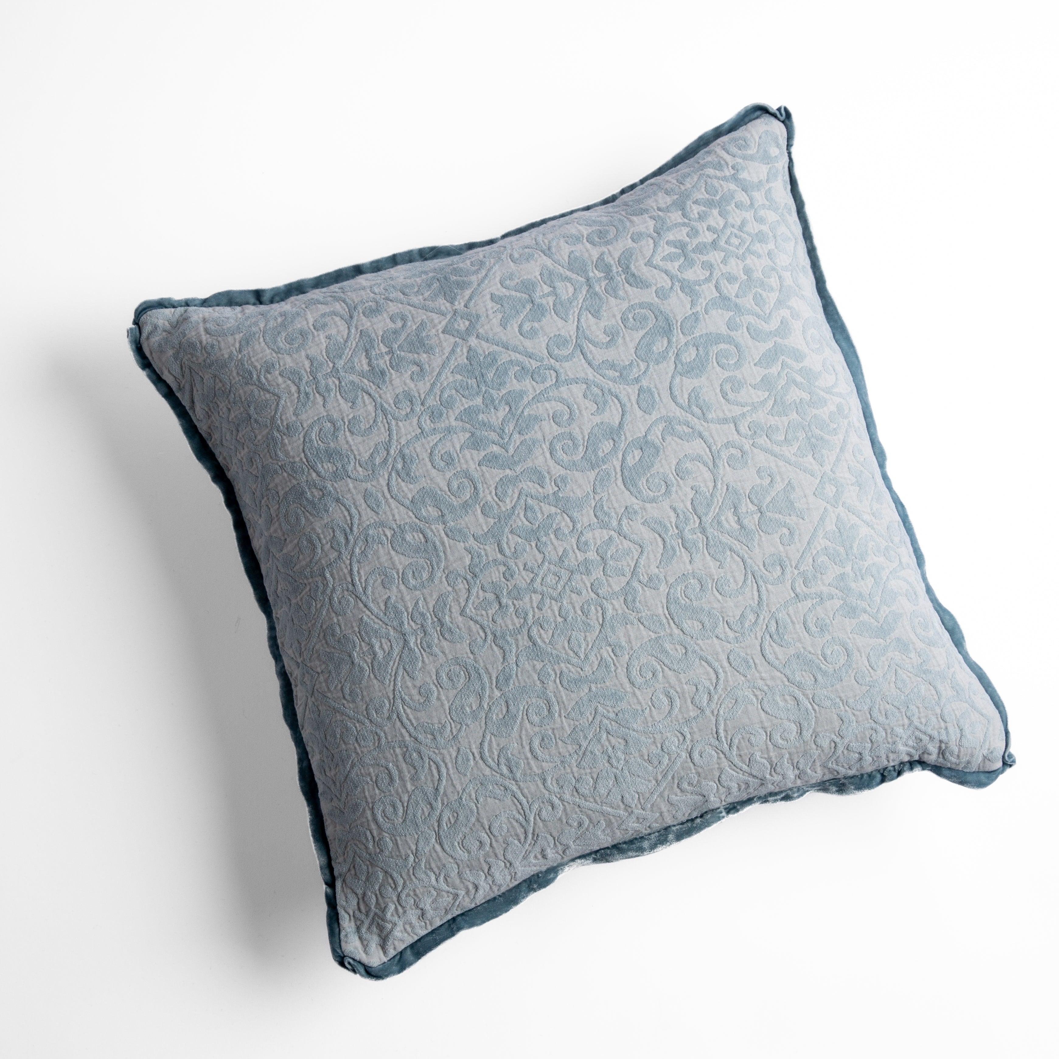 Cloud: cotton chenille jacquard 18x18 pillow shown from overhead to display the pillow's face and silk velvet trim — overhead against a white background.