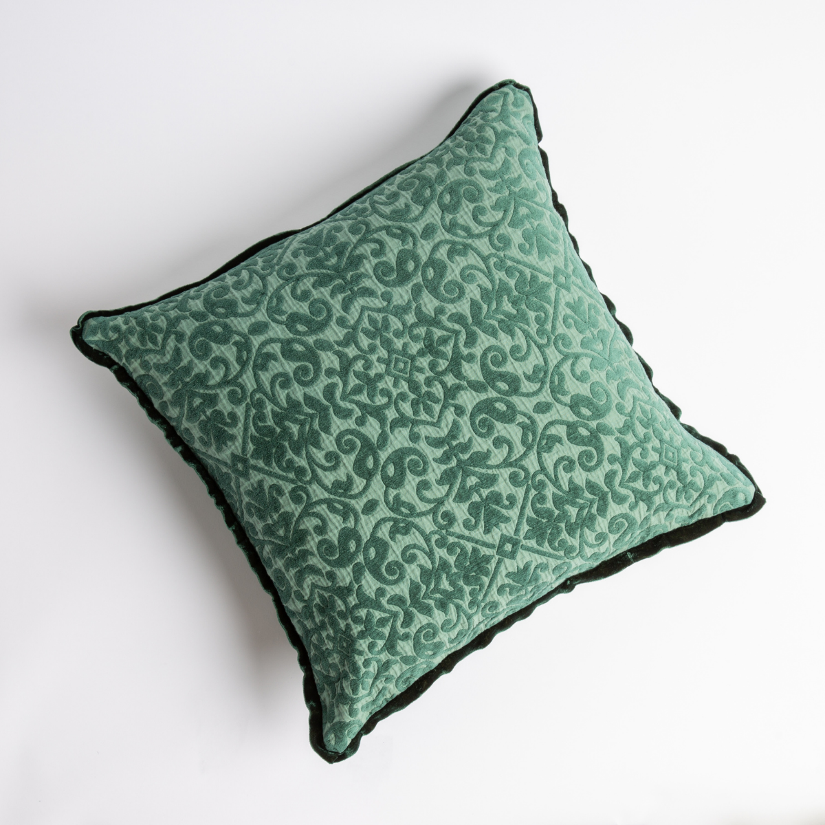 Jade: cotton chenille jacquard 18x18 pillow shown from overhead to display the pillow's face and silk velvet trim — overhead against a white background.