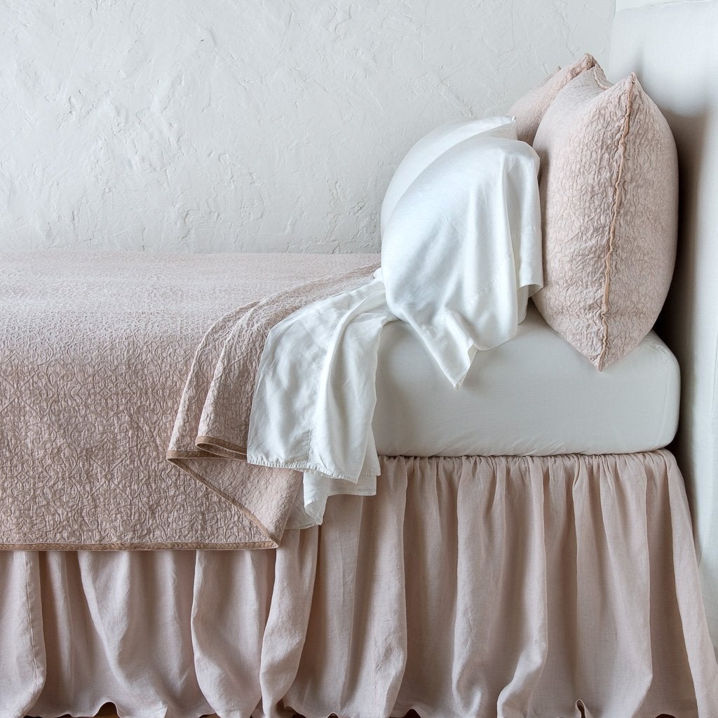 [allvariants]: Vienna coverlet and matching sham over white sheeting - pearl, side view.