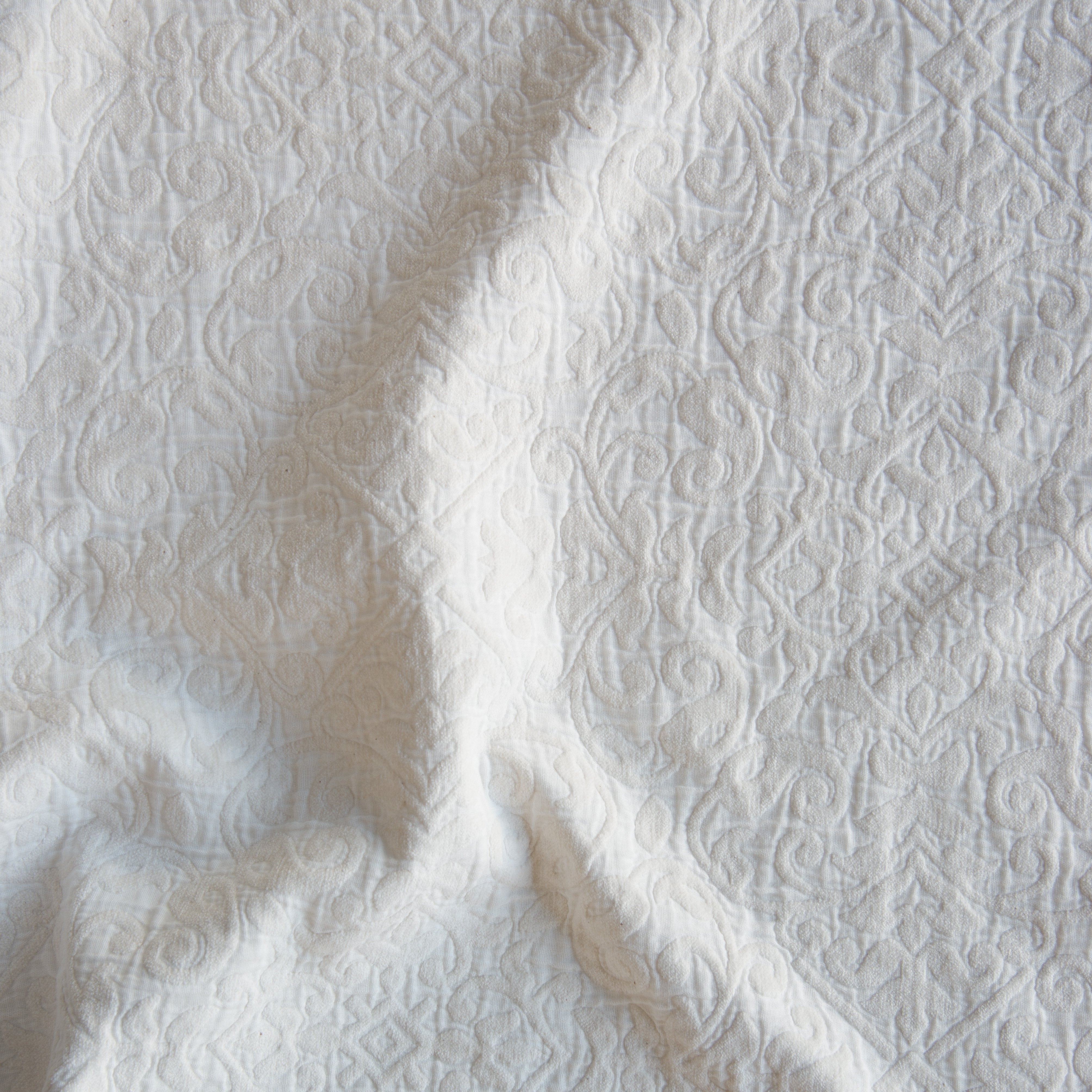Winter White: A close up of Vienna cotton chenille jacquard in winter white, softer and warmer in tone than classic white. 